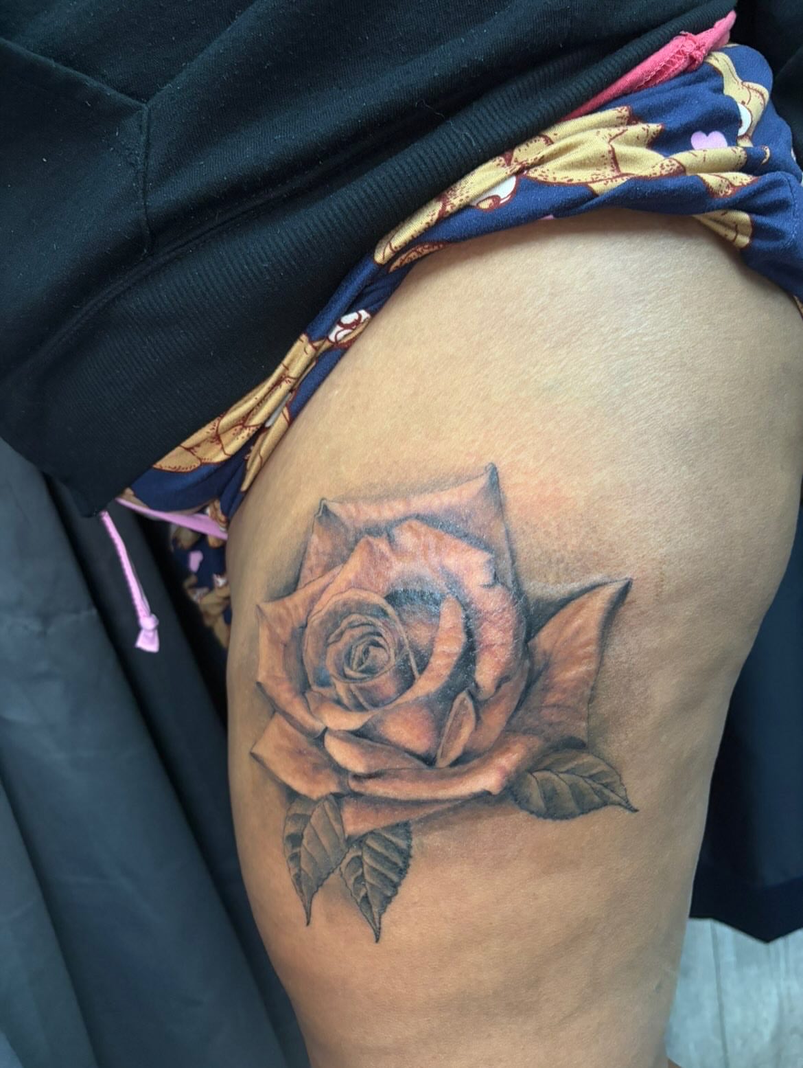 Rose realism tattoo on the thigh by Monii Arreola