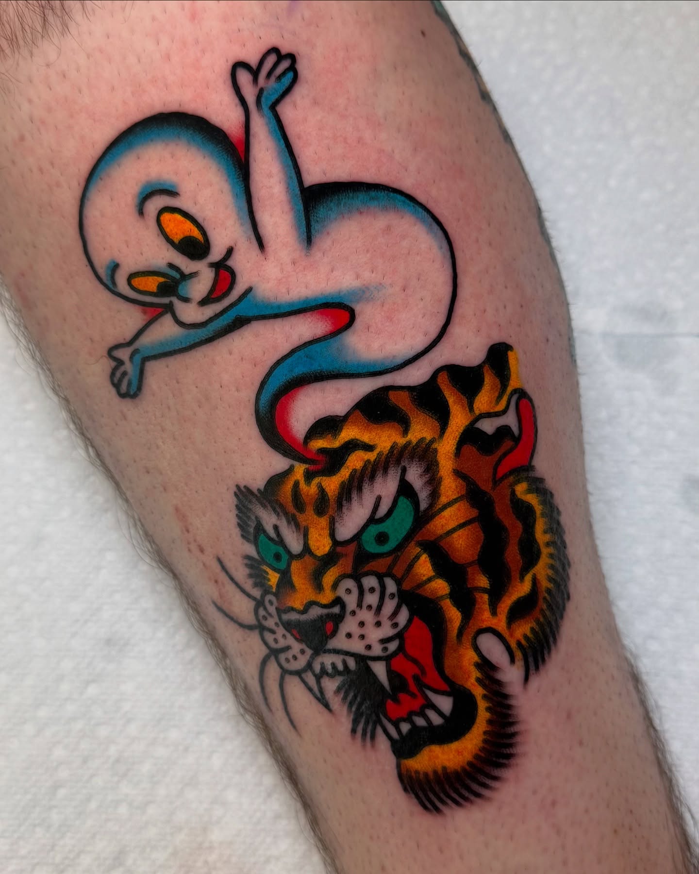 Tweety bird and tiger American traditional tattoo on the forearm by Zachary - Traditional Tattoo Artist