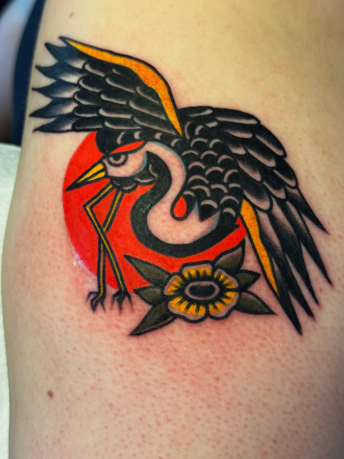 Heron and sun American traditional tattoo on the shoulder by JoJo Benton
