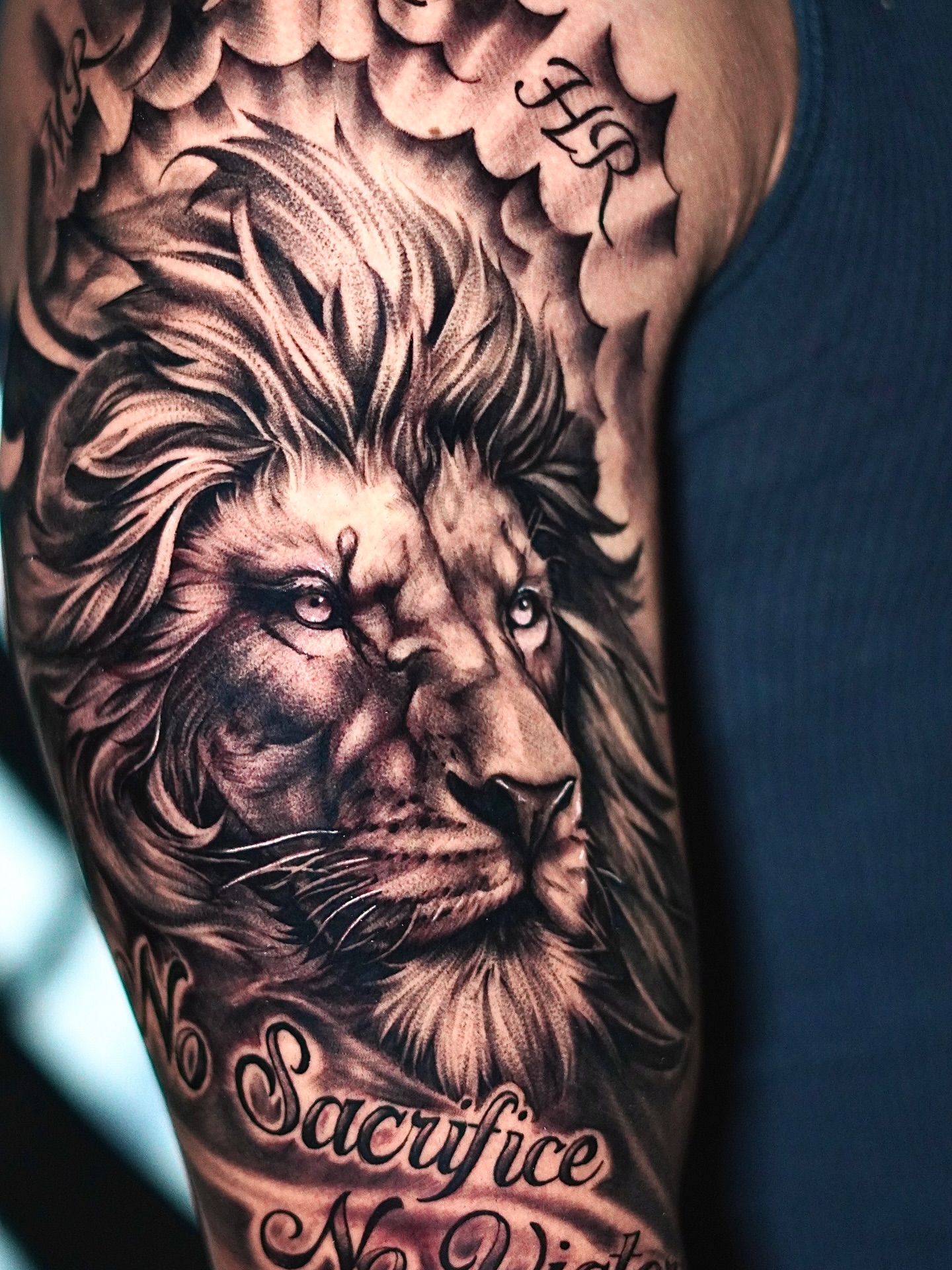 Lion realism tattoo on the forearm by Angel Gonzalez