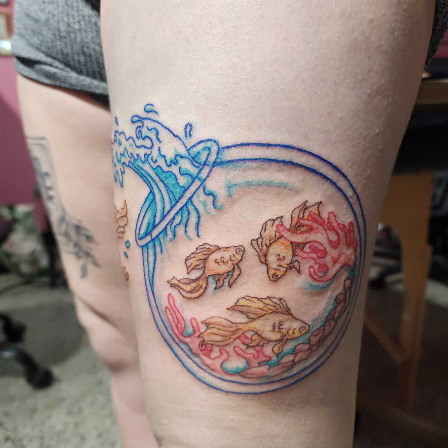 Goldfish in bowl new school tattoo on the forearm by K.F. Golden