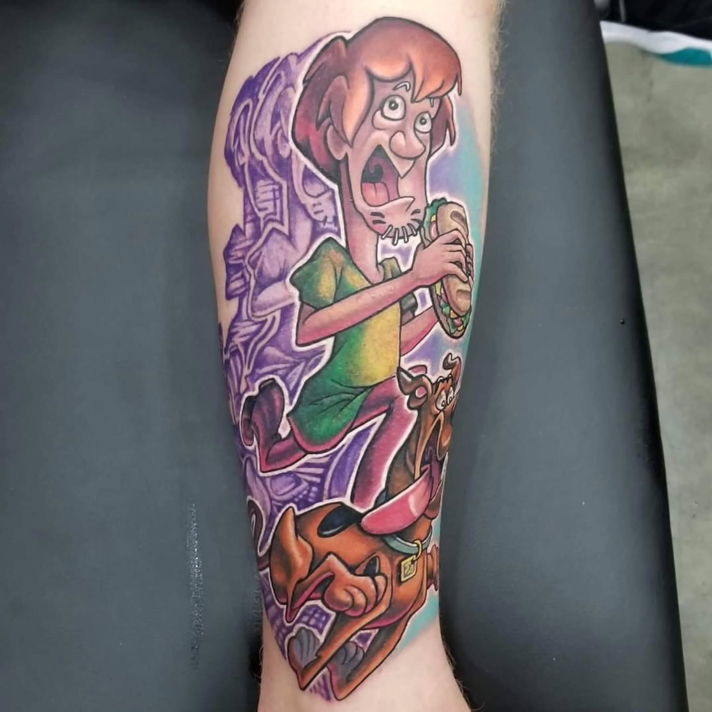 Shaggy and scooby-doo illustrative tattoo on the forearm by Chicago Tattoo Artist New School Tattoos, Naperville, Illinois