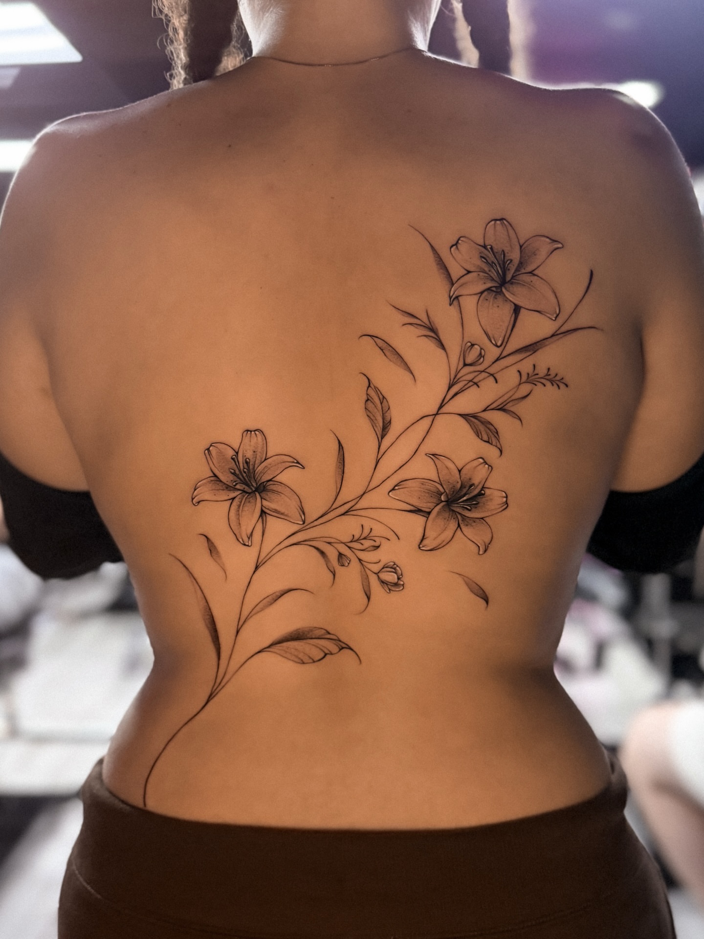 Lilies black and grey tattoo on the back by πππΉππππππππππππ