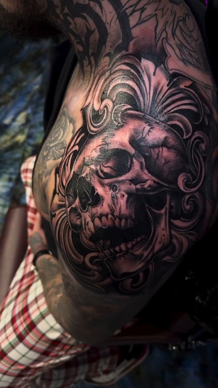 Skull with ornate filigree realism tattoo by Licensed Tattoo Artist πΈπ»