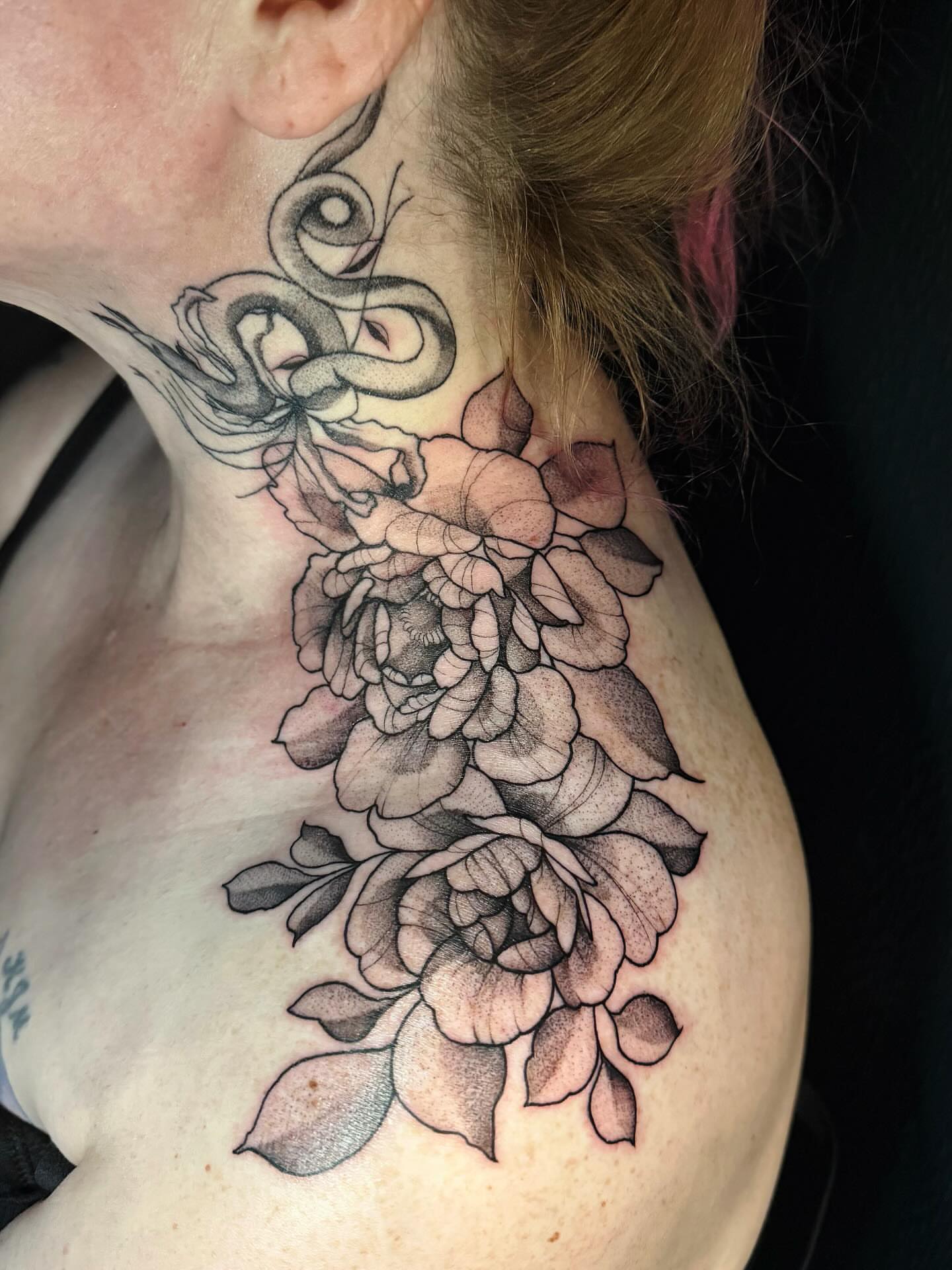 Snake and peony realism tattoo on the neck by Emily