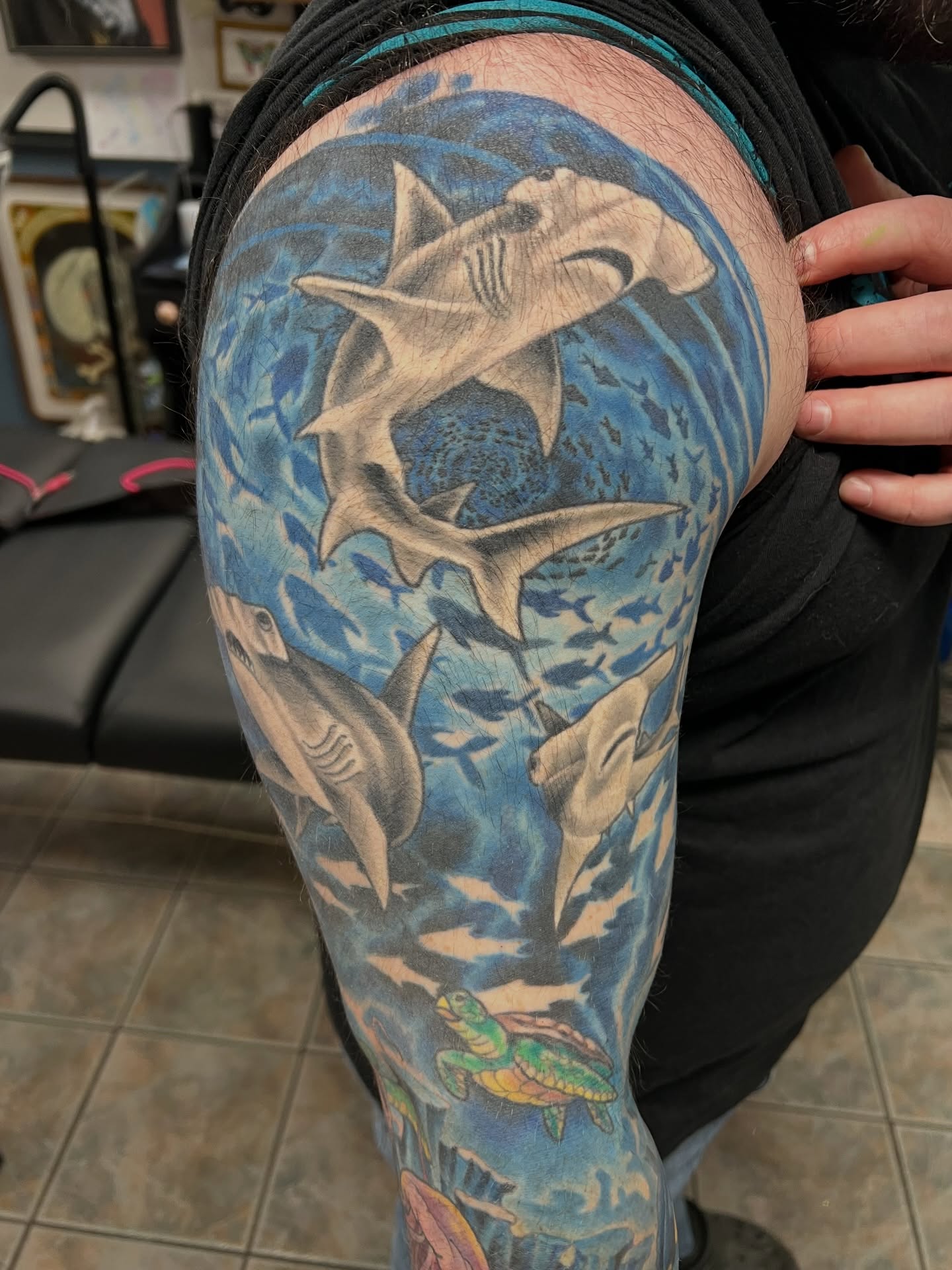 Sharks and sea life realism tattoo on the upper arm by Corey Thompson, Butler, Pennsylvania