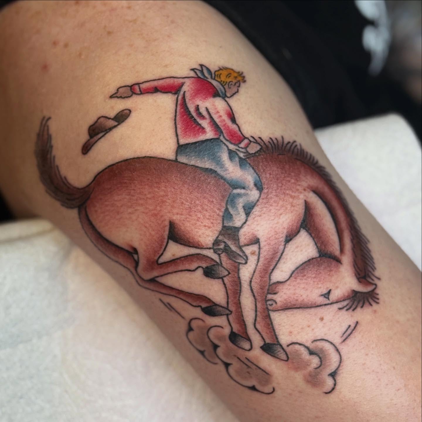 Bull riding realism tattoo on the thigh by chloe jeanel estrada