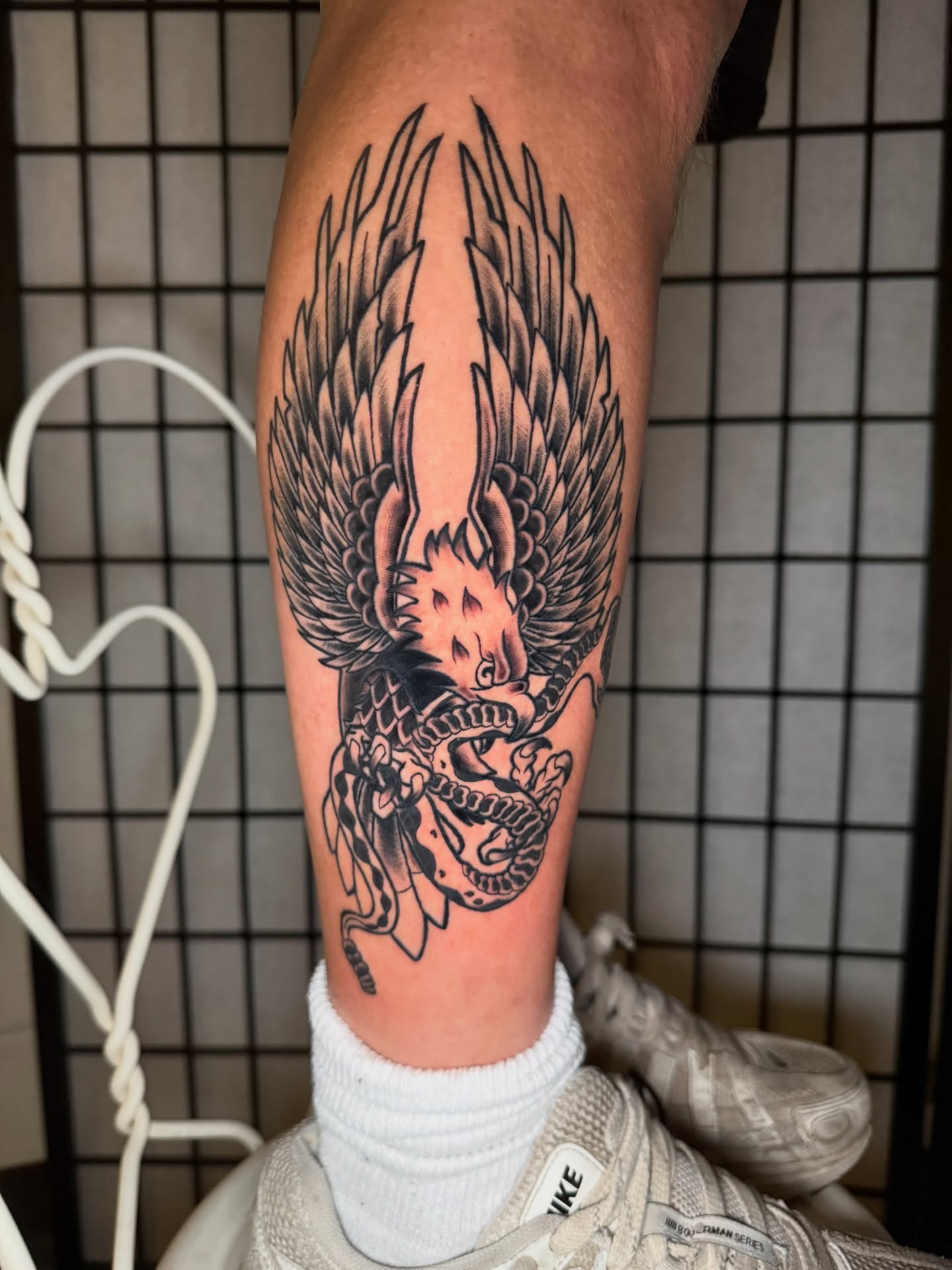 Dragon black and grey tattoo on the calf by Austin Poliszuk, Minneapolis, Minnesota