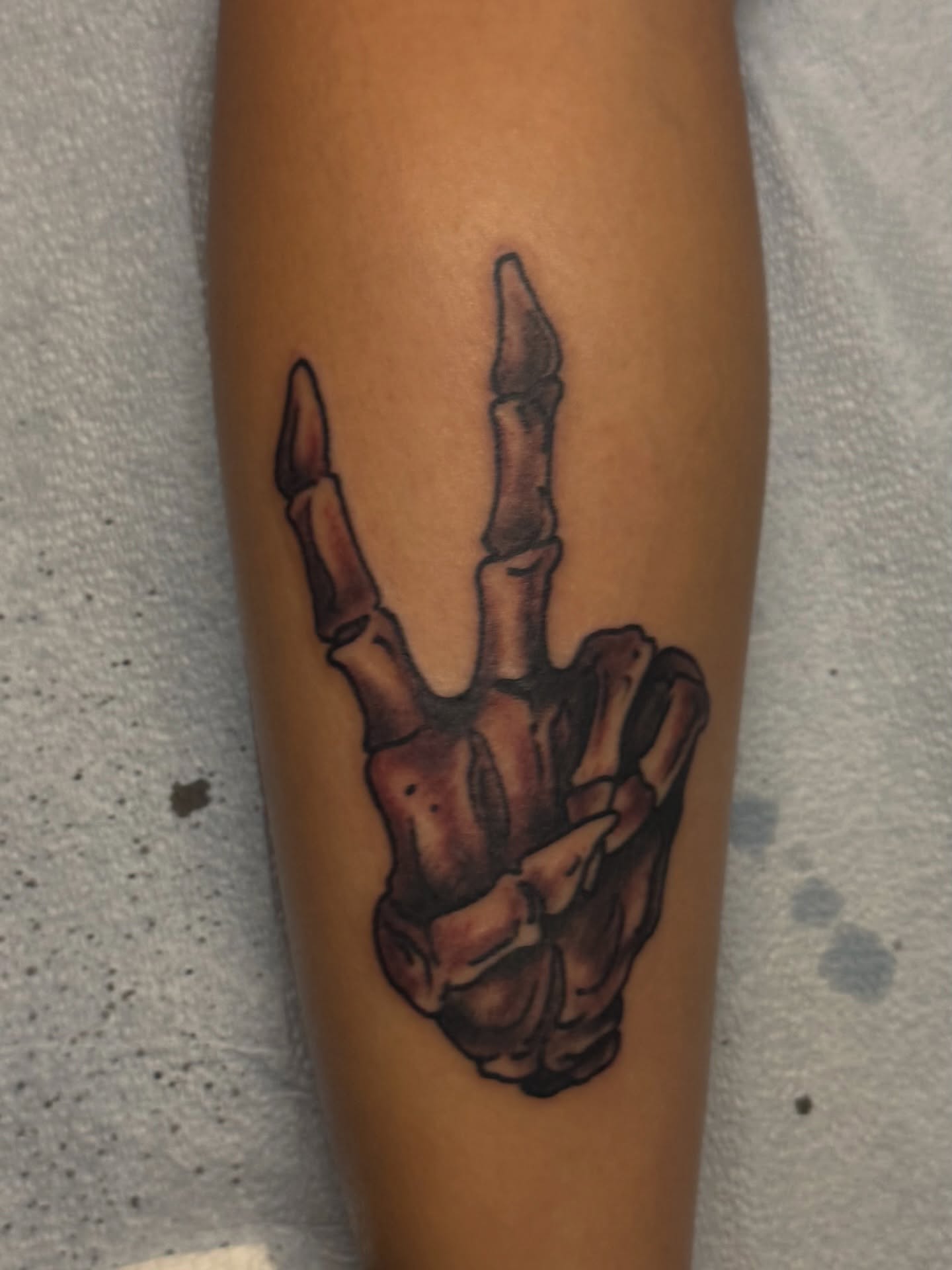 Skeleton hand realism tattoo on the forearm by Waylon