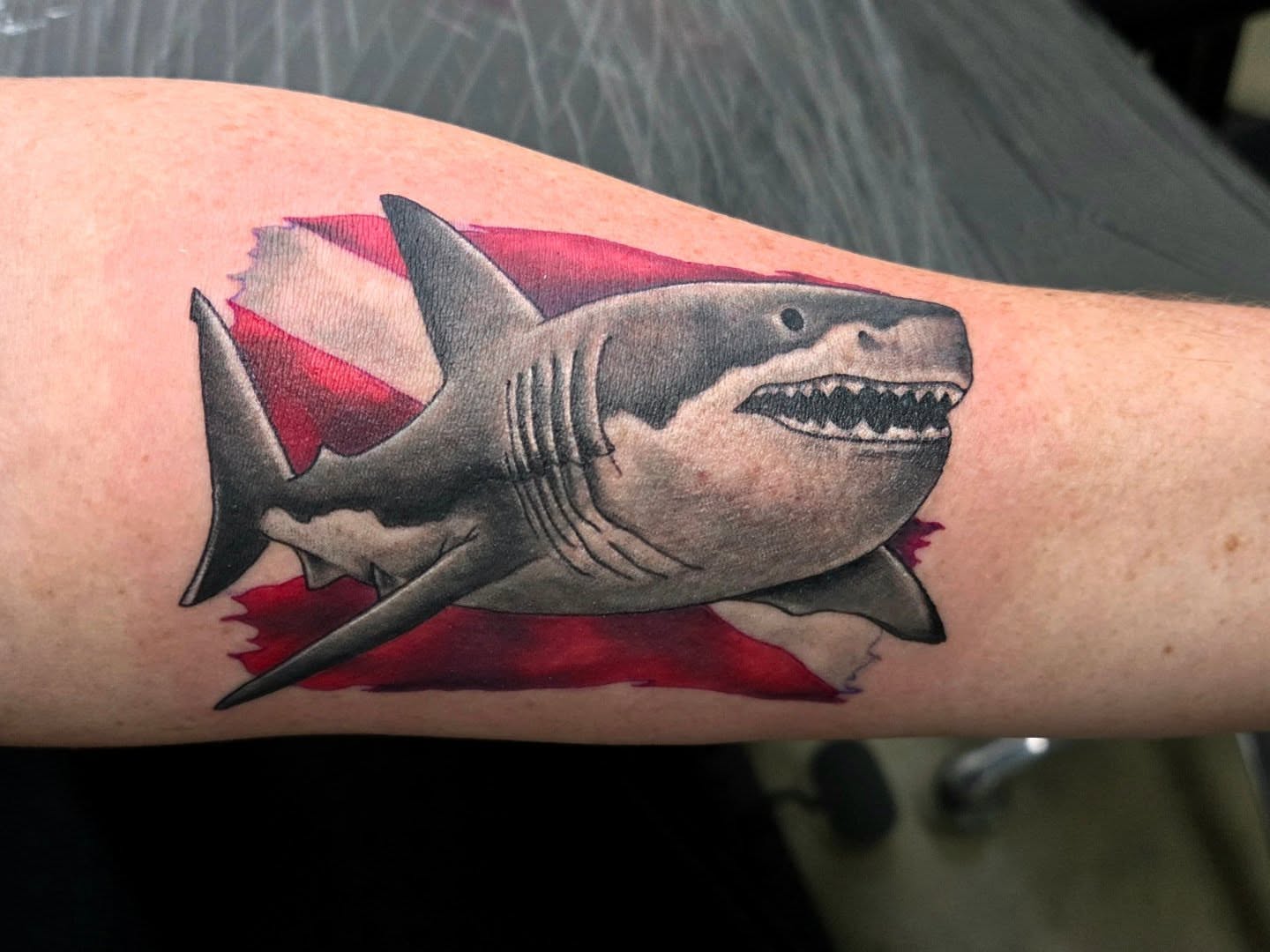 Great white shark realism tattoo on the forearm by Ashley