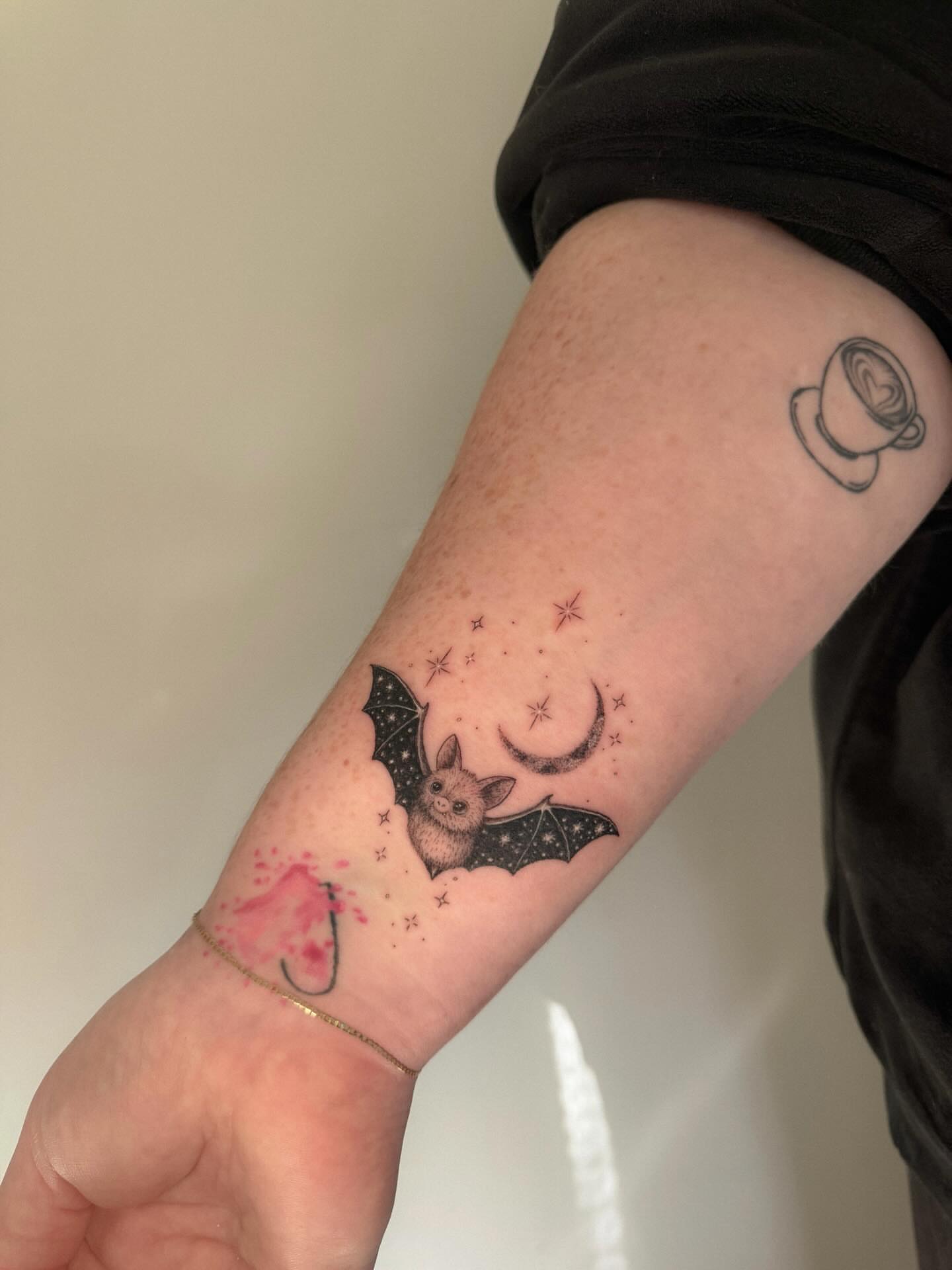 Bat and crescent moon dotwork tattoo on the forearm by Cat girl tattoo