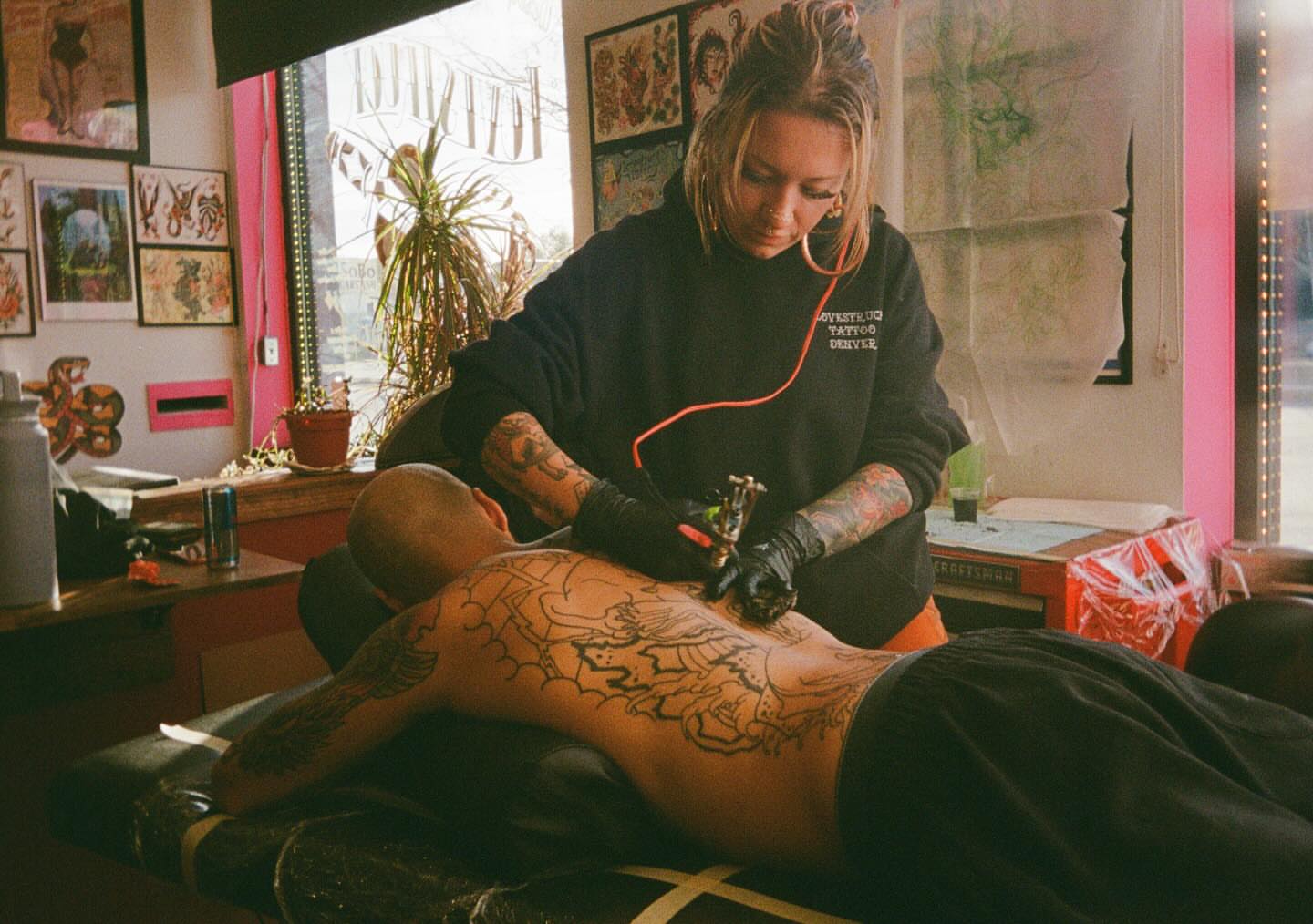 Floral design American traditional tattoo on the back by Mika Clairissa