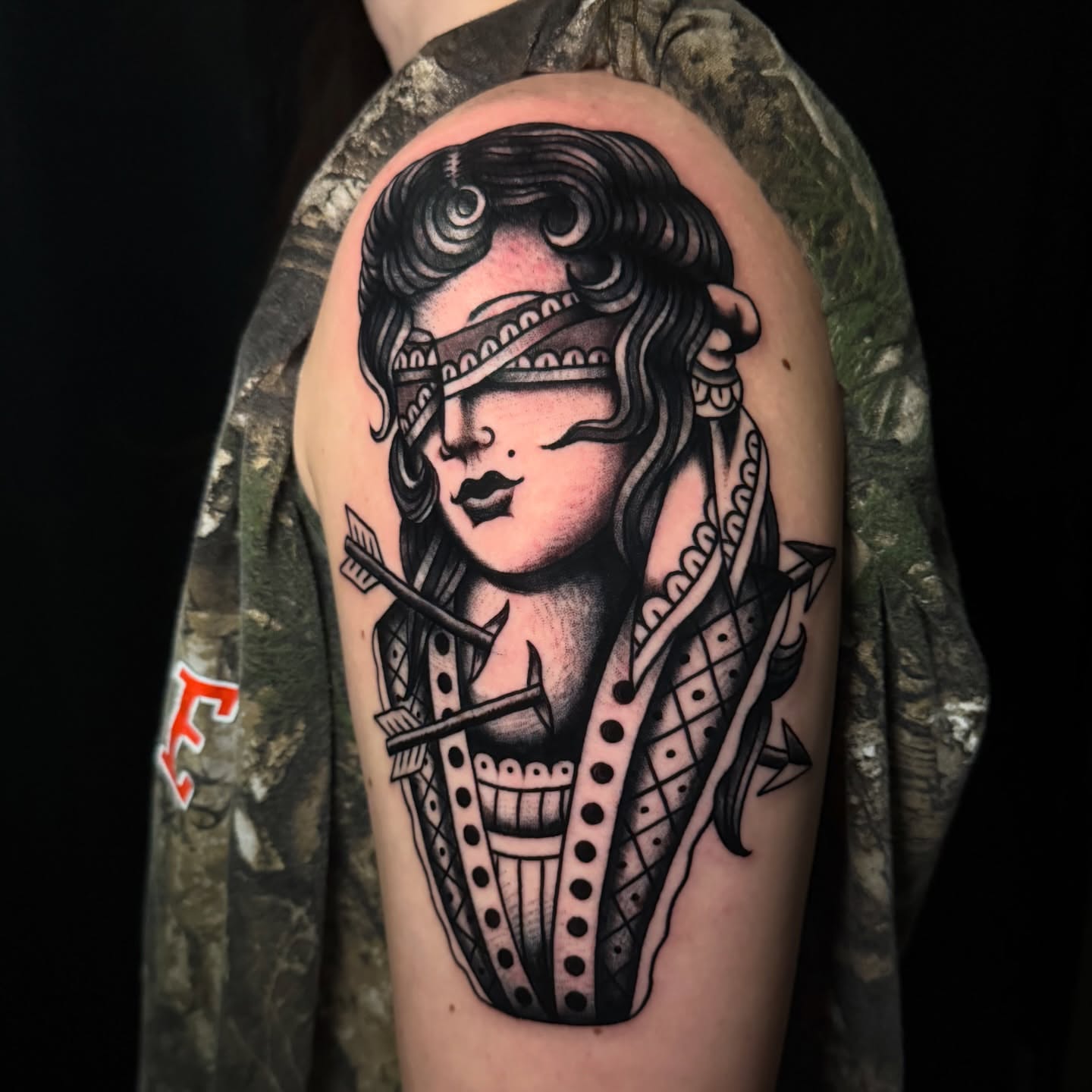 Woman with blindfold American traditional tattoo on the shoulder by Brandon Bear
