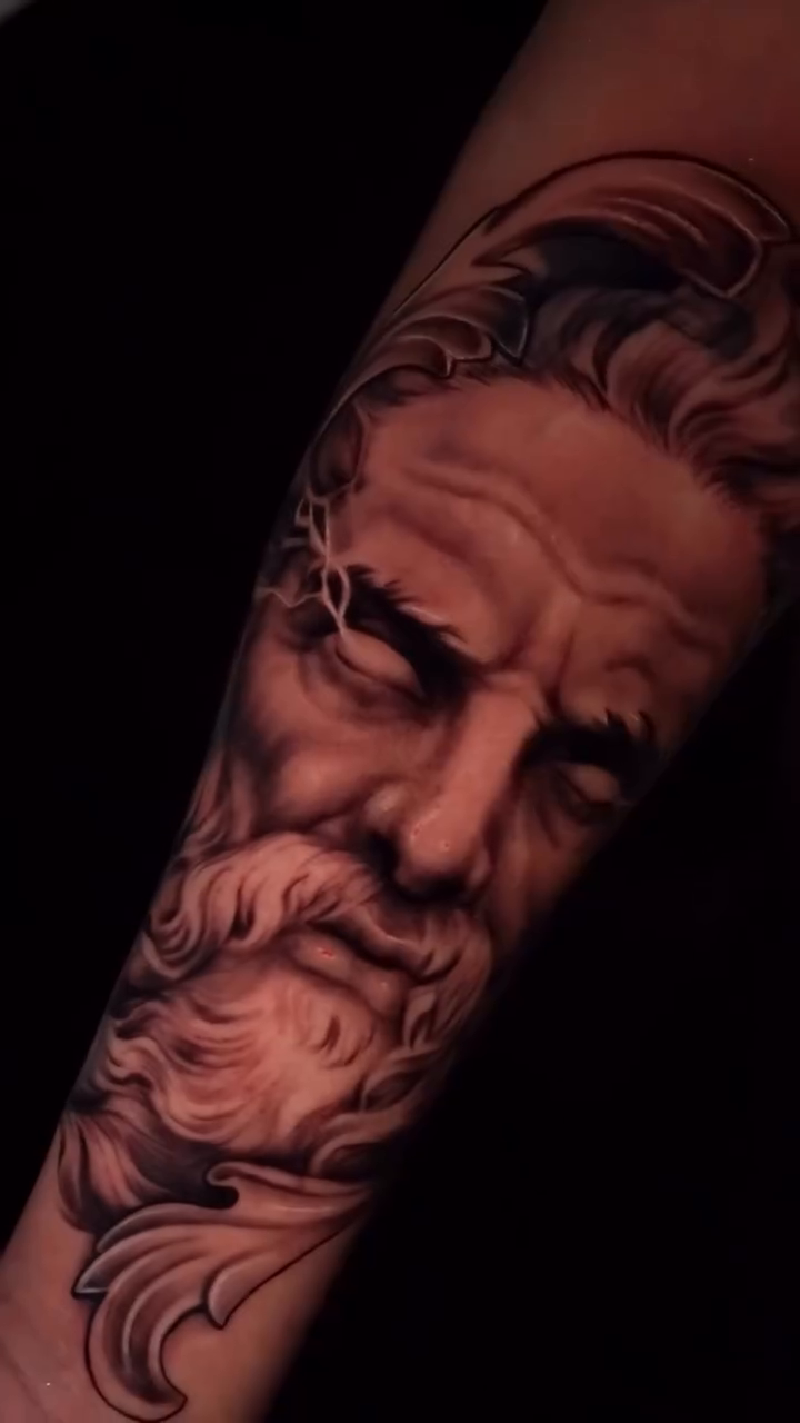 Portrait of an old man surrealism tattoo on the forearm by Jennifer Garcia