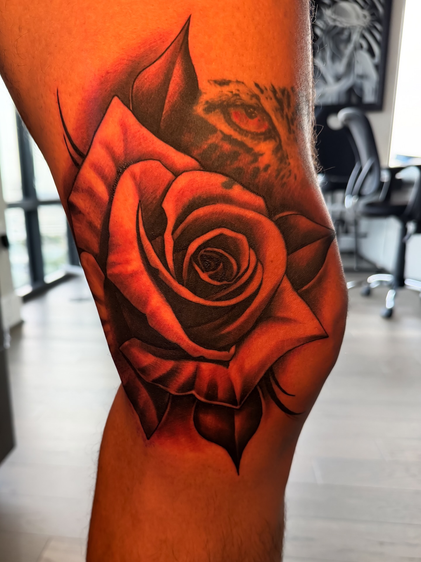 Rose realism tattoo on the thigh by Josh Acosta