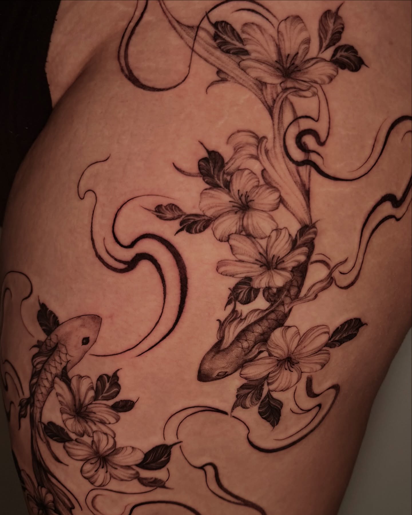 Koi fish and flowers ornamental tattoo on the shoulder by Sab