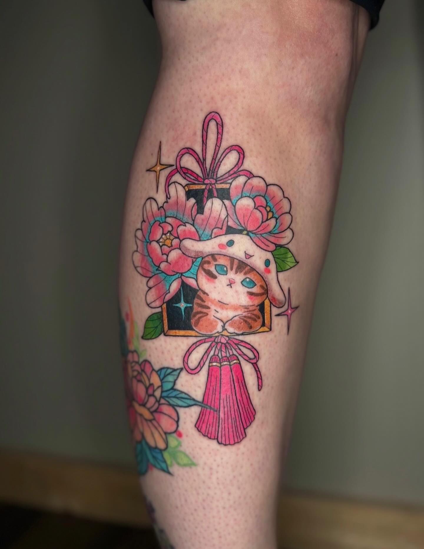 Cat with flowers new school tattoo on the thigh by Brandi 🕷, Mentor, Ohio
