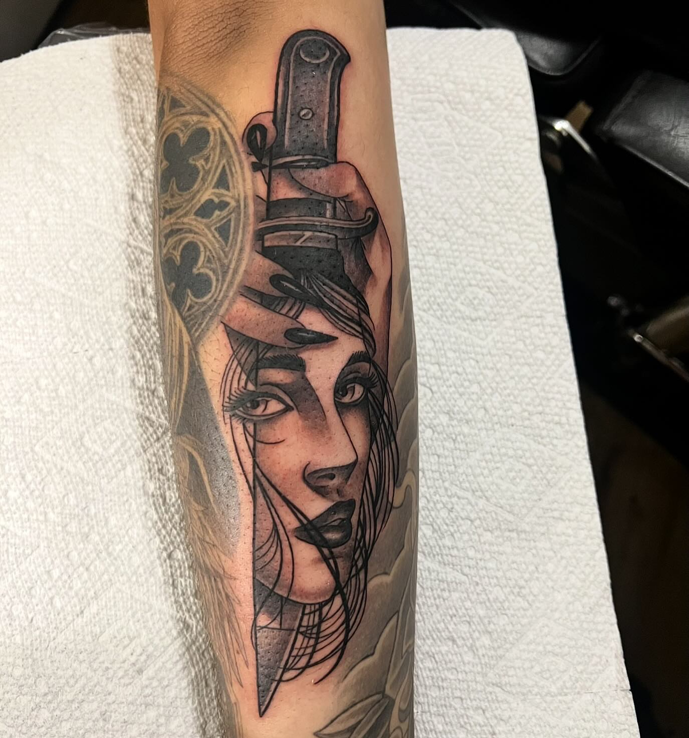 Woman with knife realism tattoo on the forearm by Jay