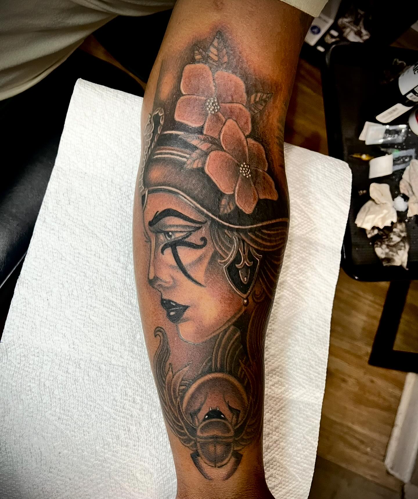 Woman with flowers realism tattoo on the forearm by Jay