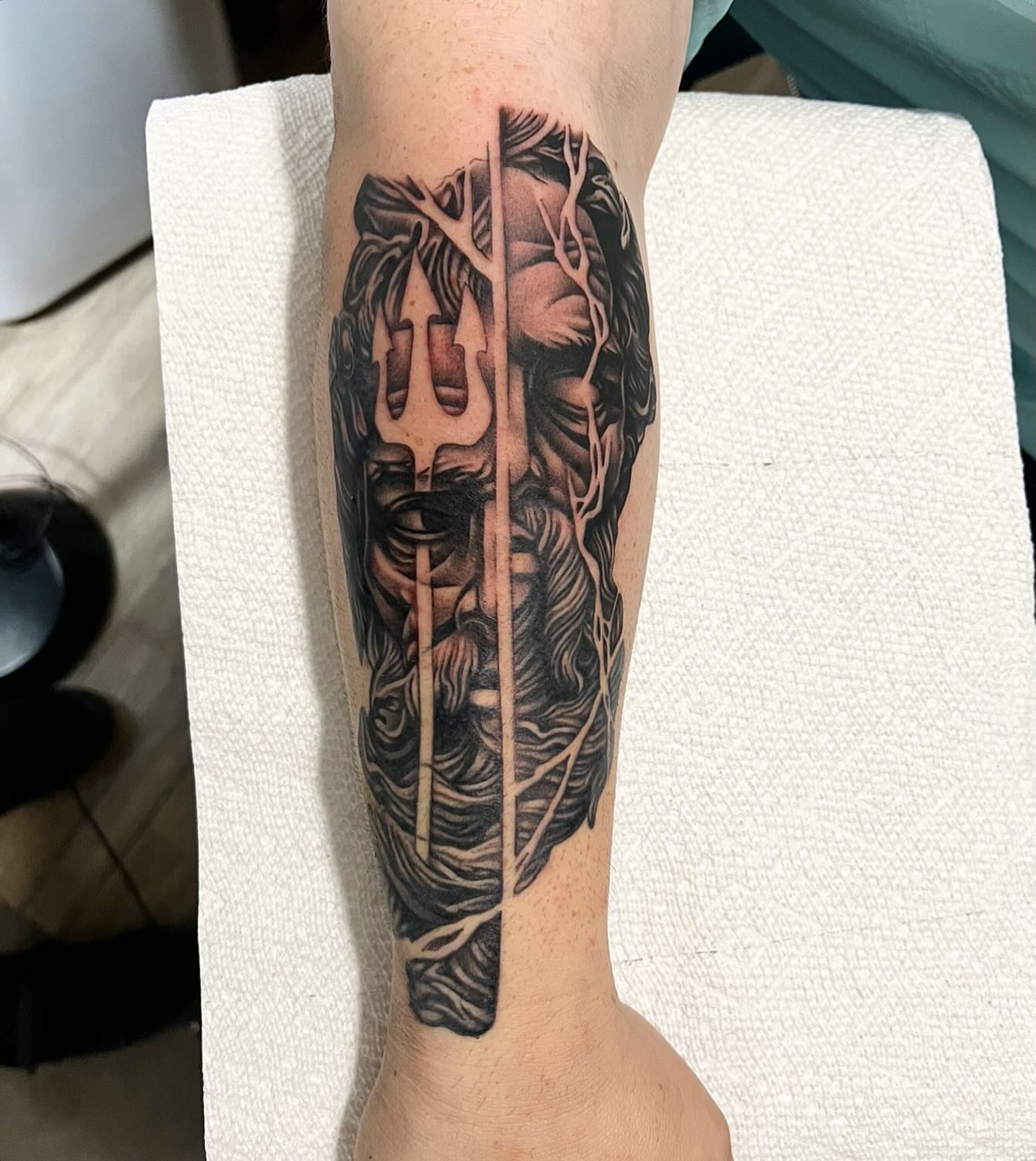 God-like figure realism tattoo on the forearm by Jay