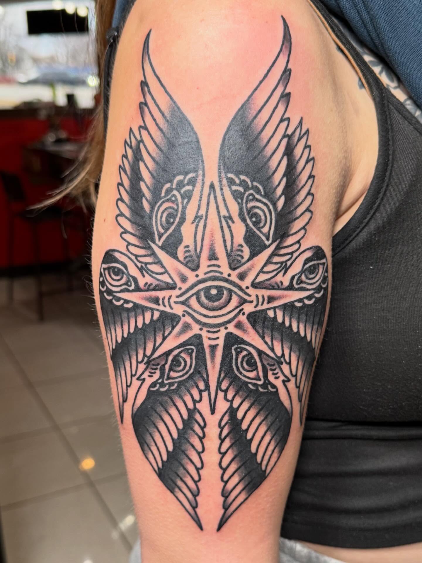 Eye and wings geometric tattoo on the shoulder by Bill Crawford, Plymouth, Michigan