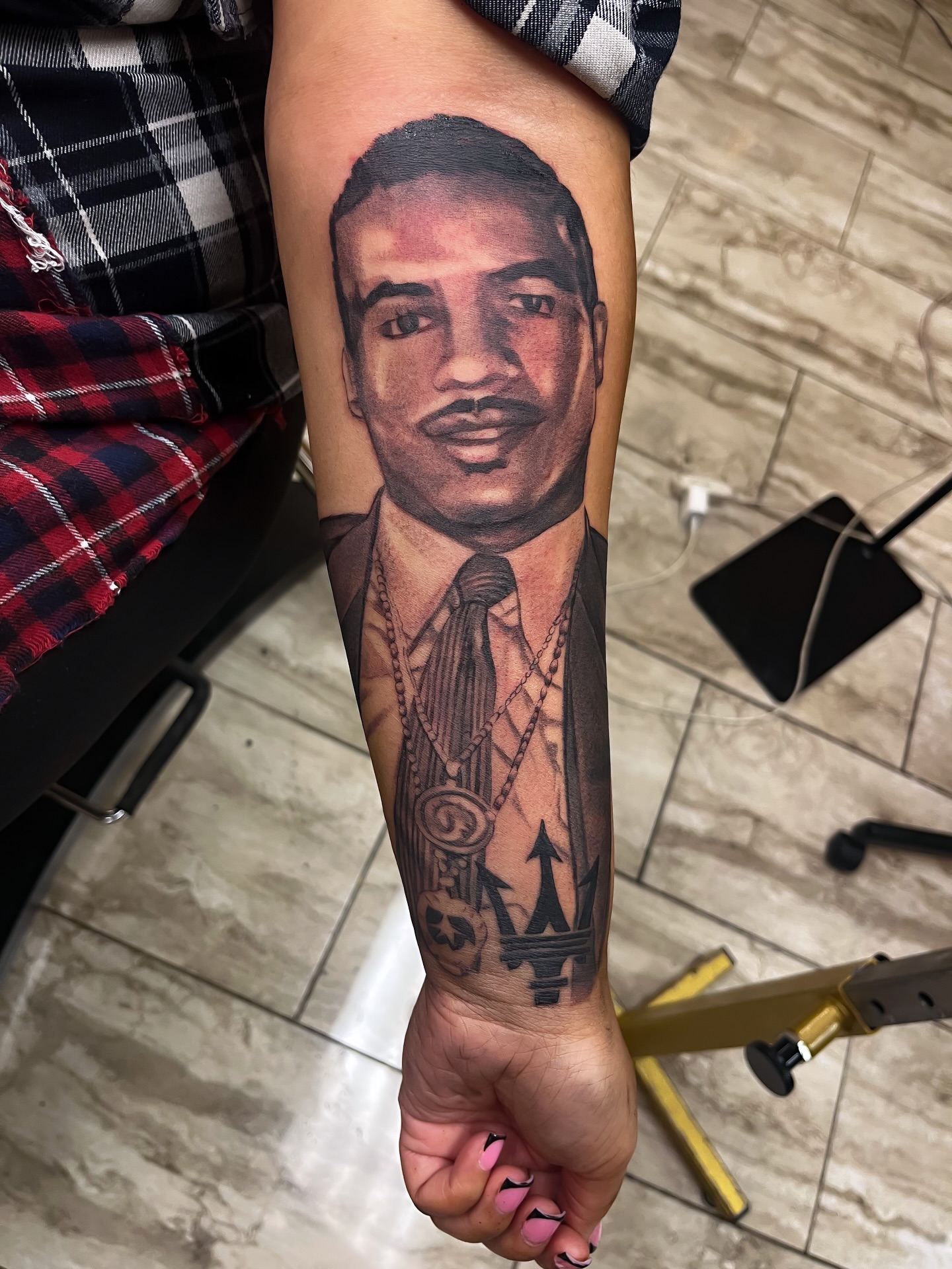 Portrait realism tattoo on the forearm by Quinten Harper