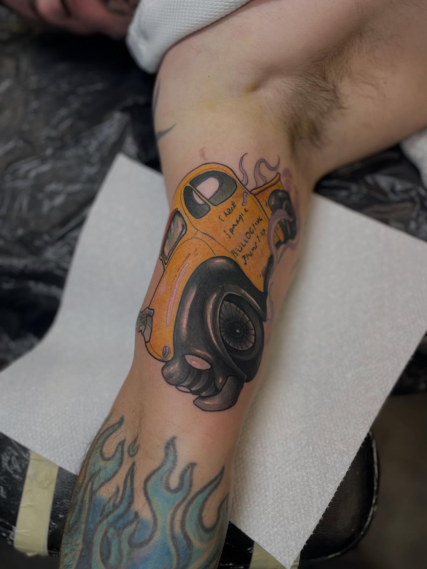 Vintage car realism tattoo on the forearm by Nathan Evans