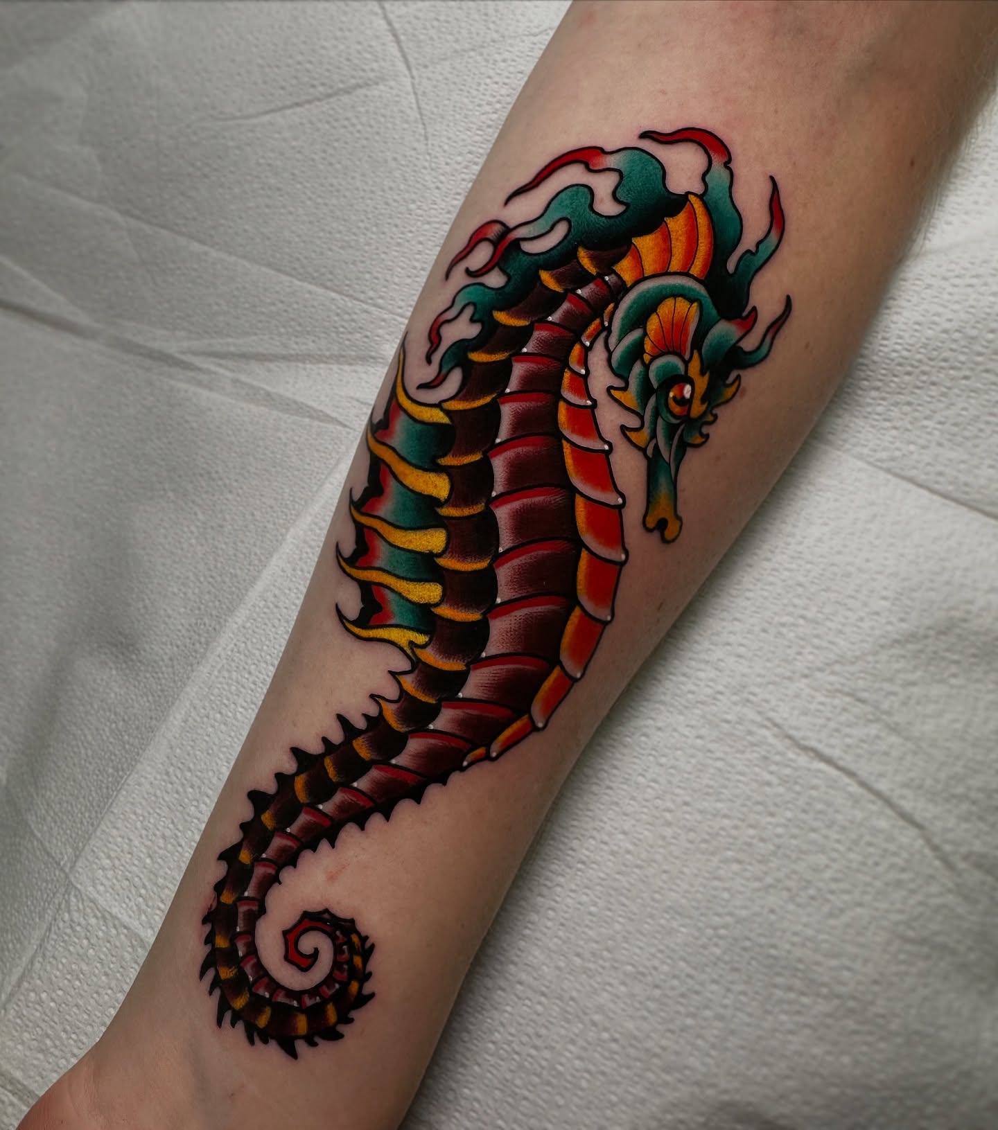Serpent American traditional tattoo on the forearm by Patrick Whiting