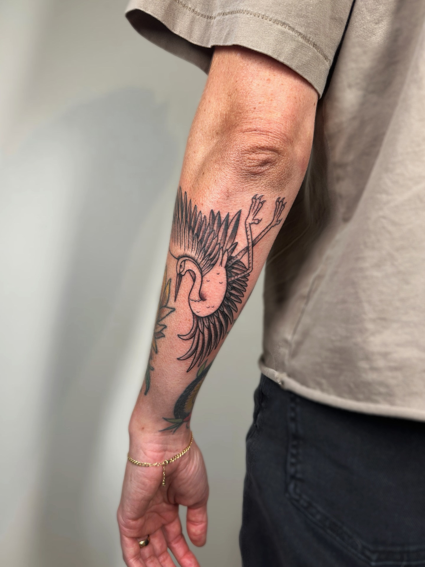 Swan black and grey tattoo on the forearm by Kail