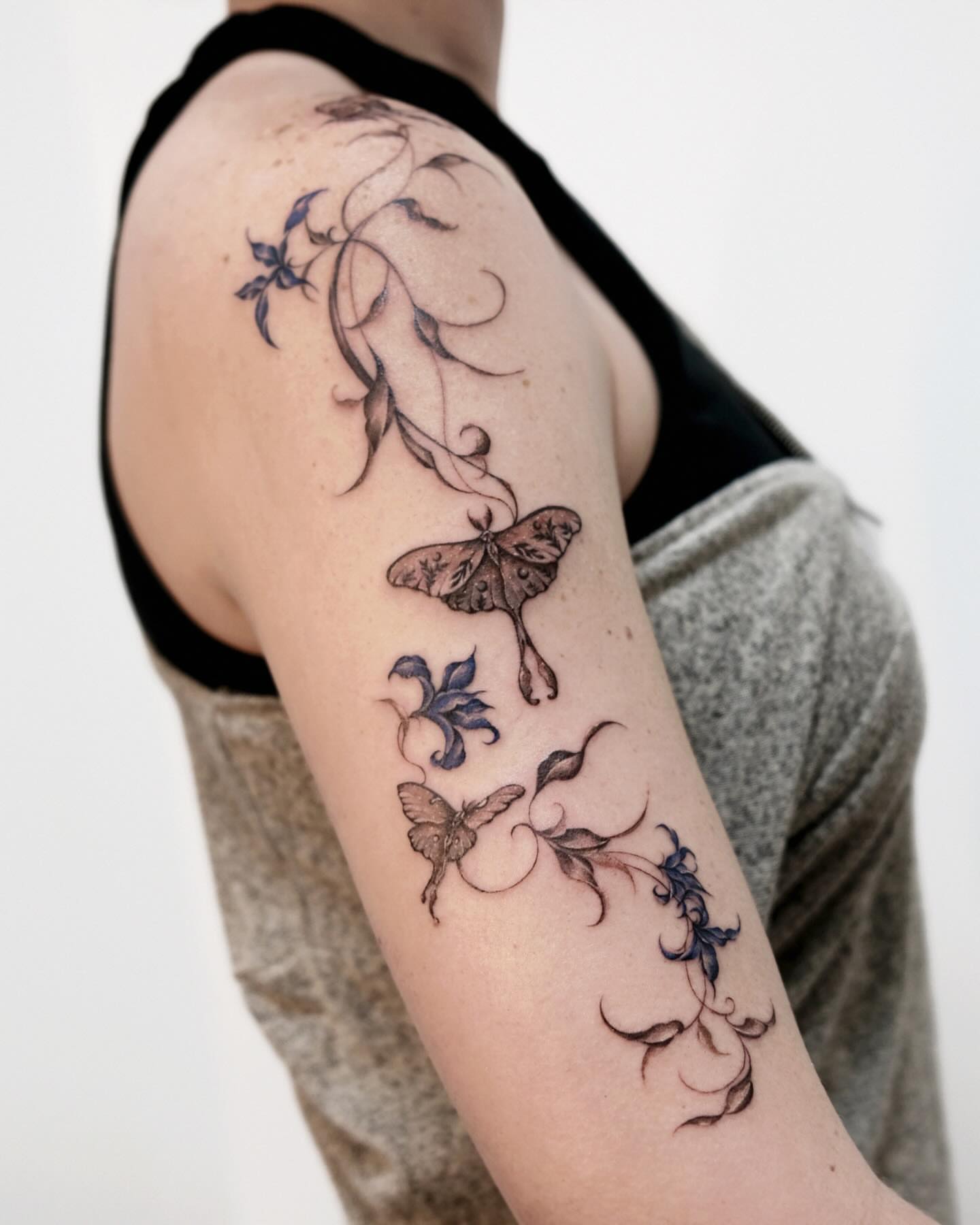 Butterfly and floral black and grey tattoo on the forearm by 애박 ⋆⁺₊ ₊⁺⋆ Aebak