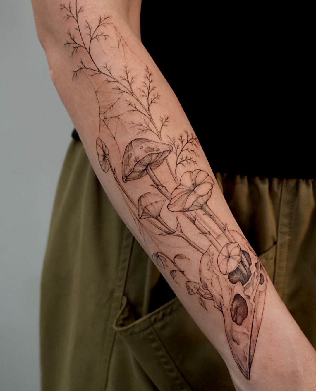 Mushroom and skull realism tattoo on the forearm by Hyn[hin]