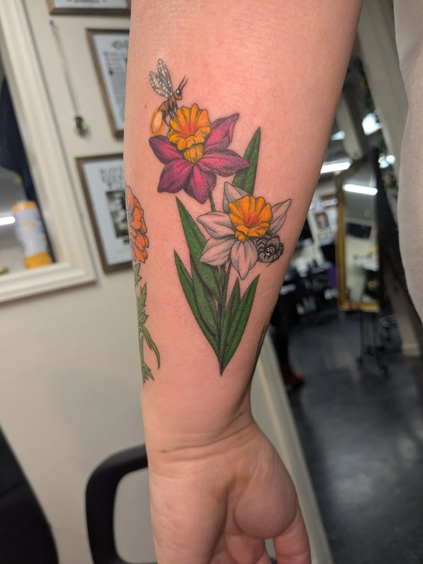 Spring flowers realism tattoo on the forearm by Jessica Thomas Fleischman, Morganton, North Carolina
