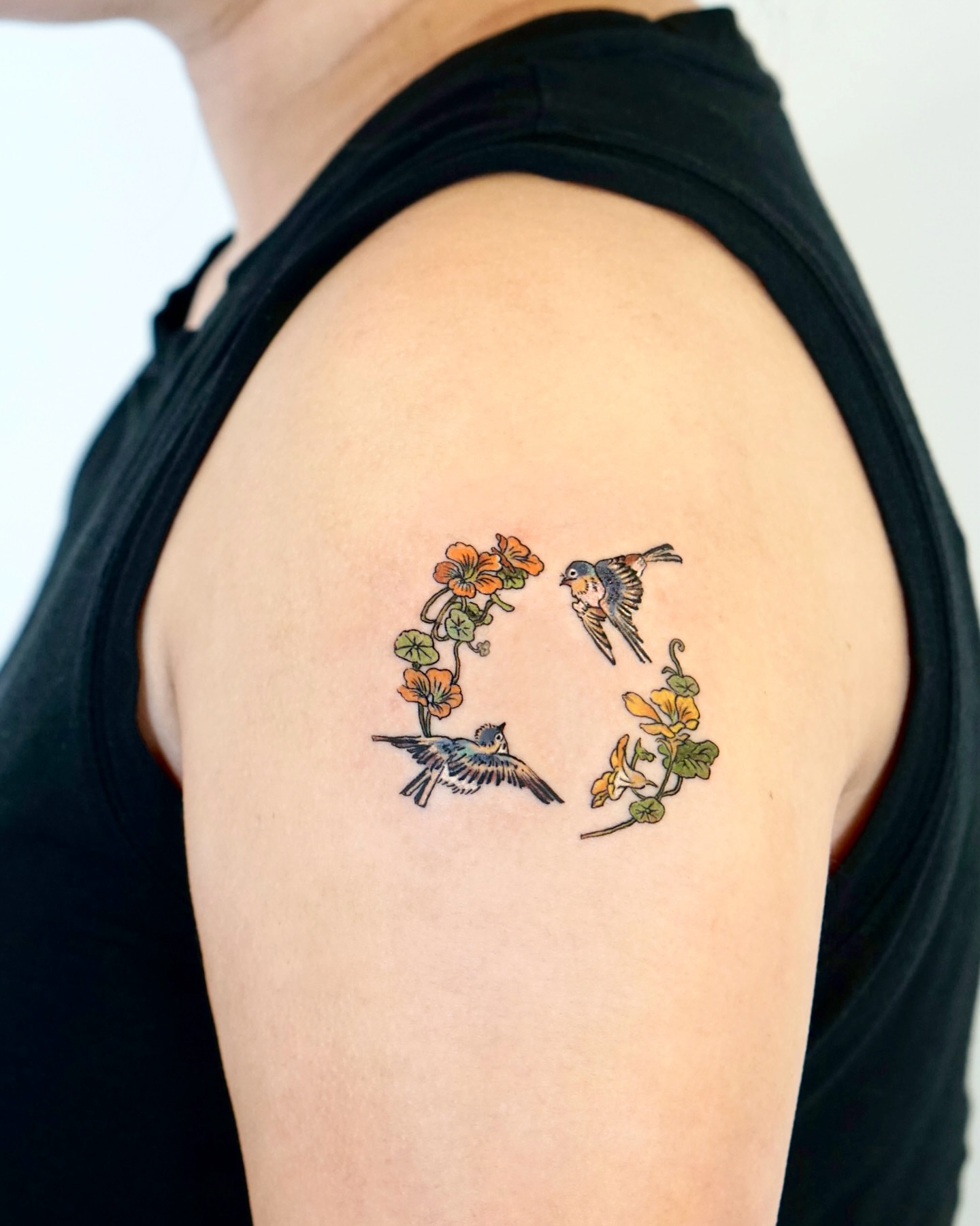 Birds and flowers new school tattoo on the shoulder by Isle