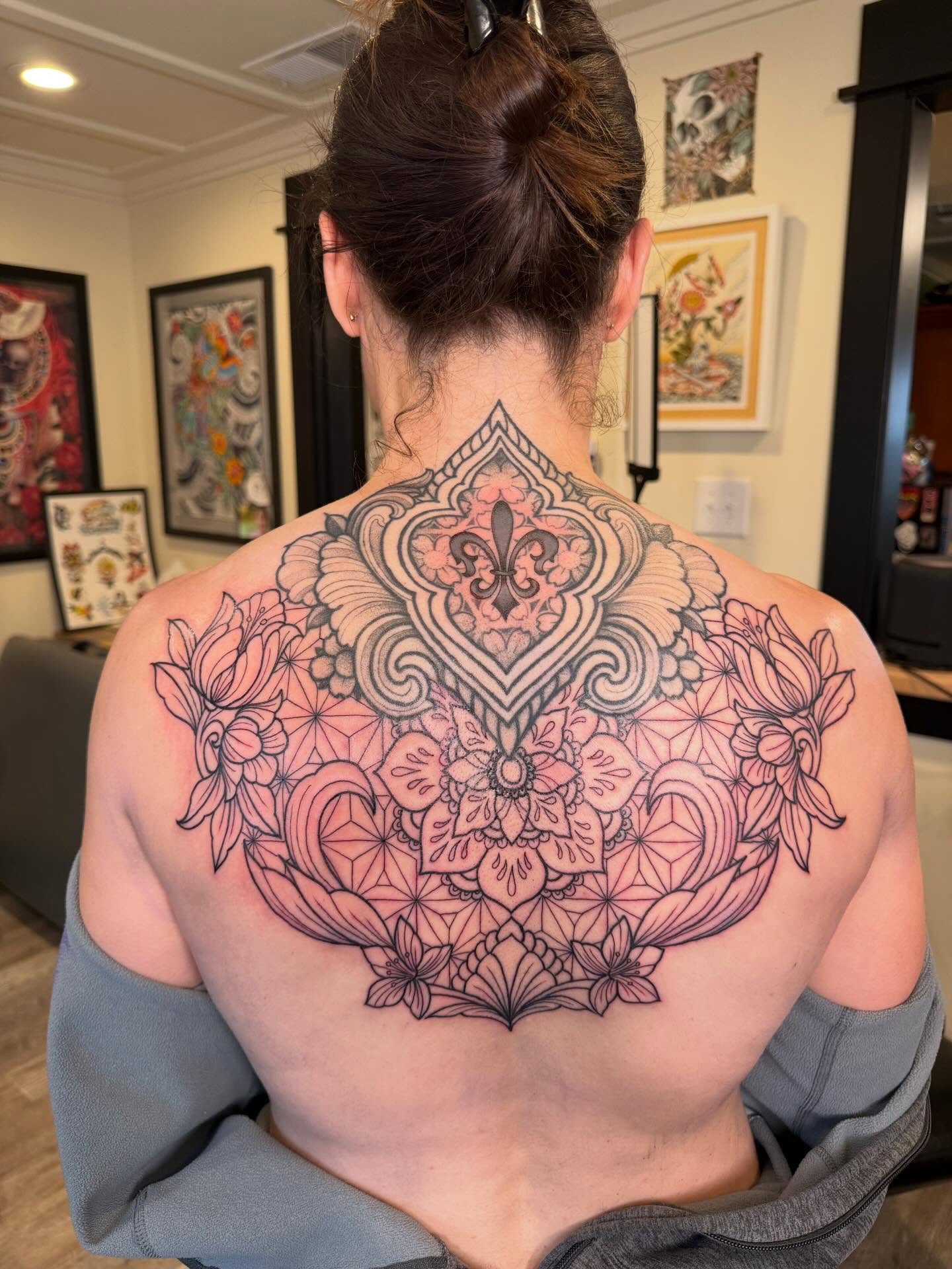 Floral mandala ornamental tattoo on the back by Rebecca Basma Smith