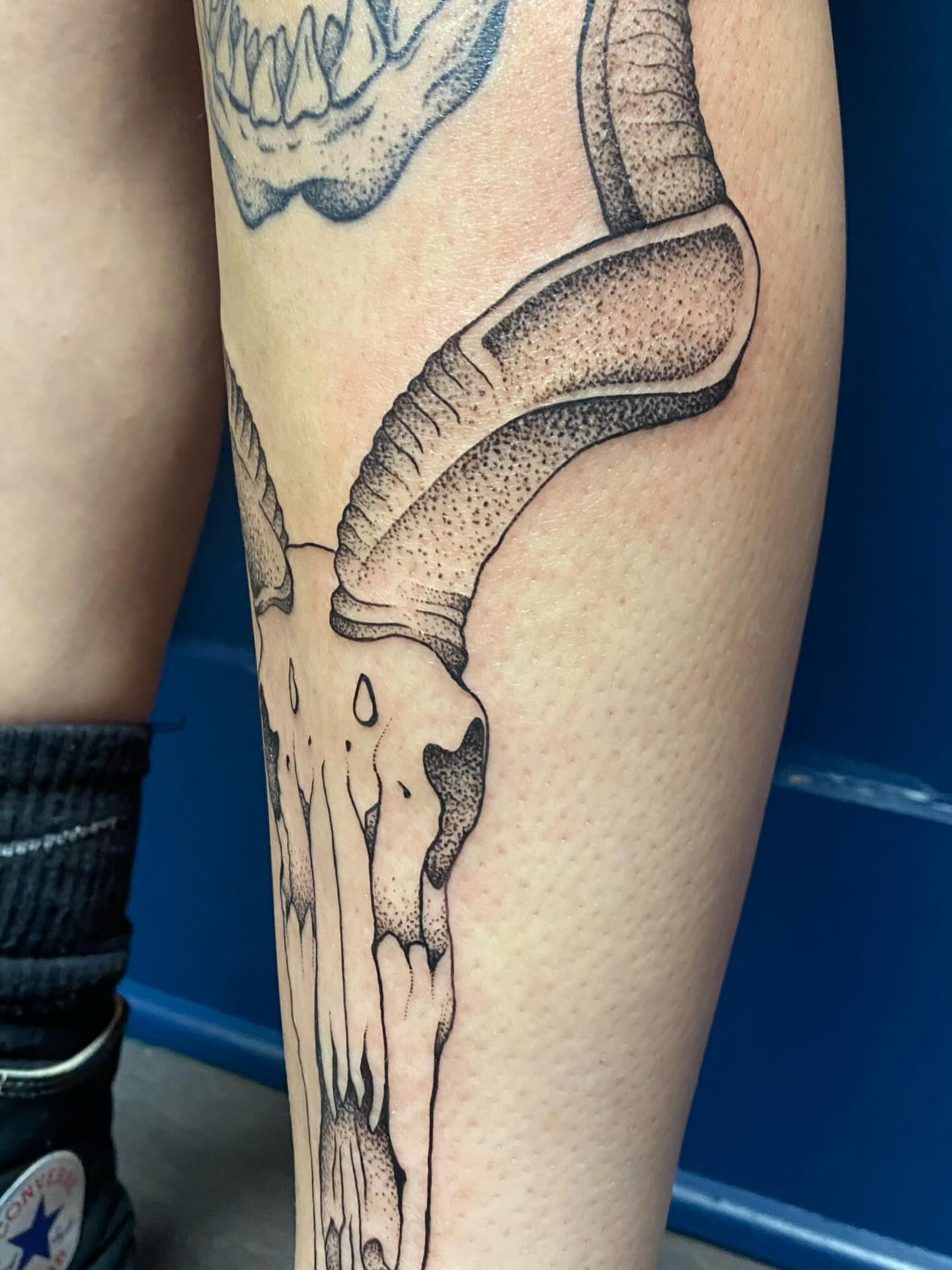 Boomerang dotwork tattoo on the forearm by Jesikah Rapp