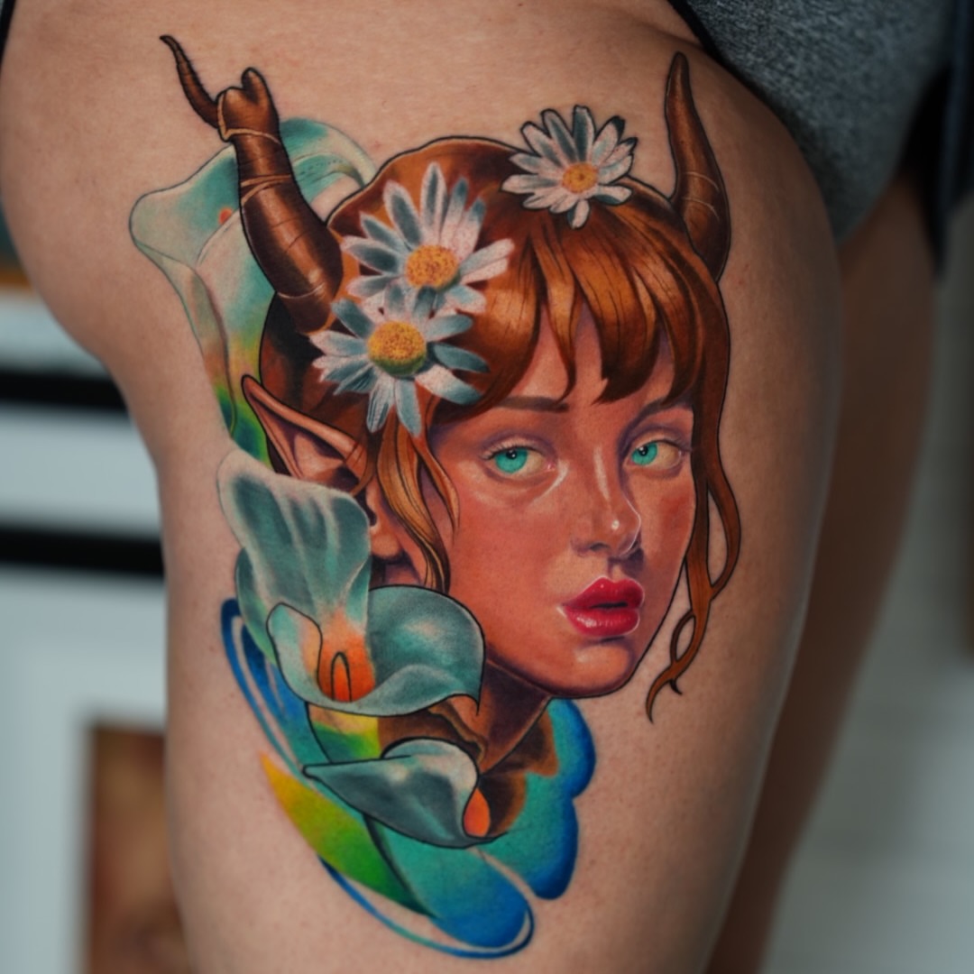 Woman with horns and flowers realism tattoo on the thigh by Lucas Garcia - New York tattoo artist