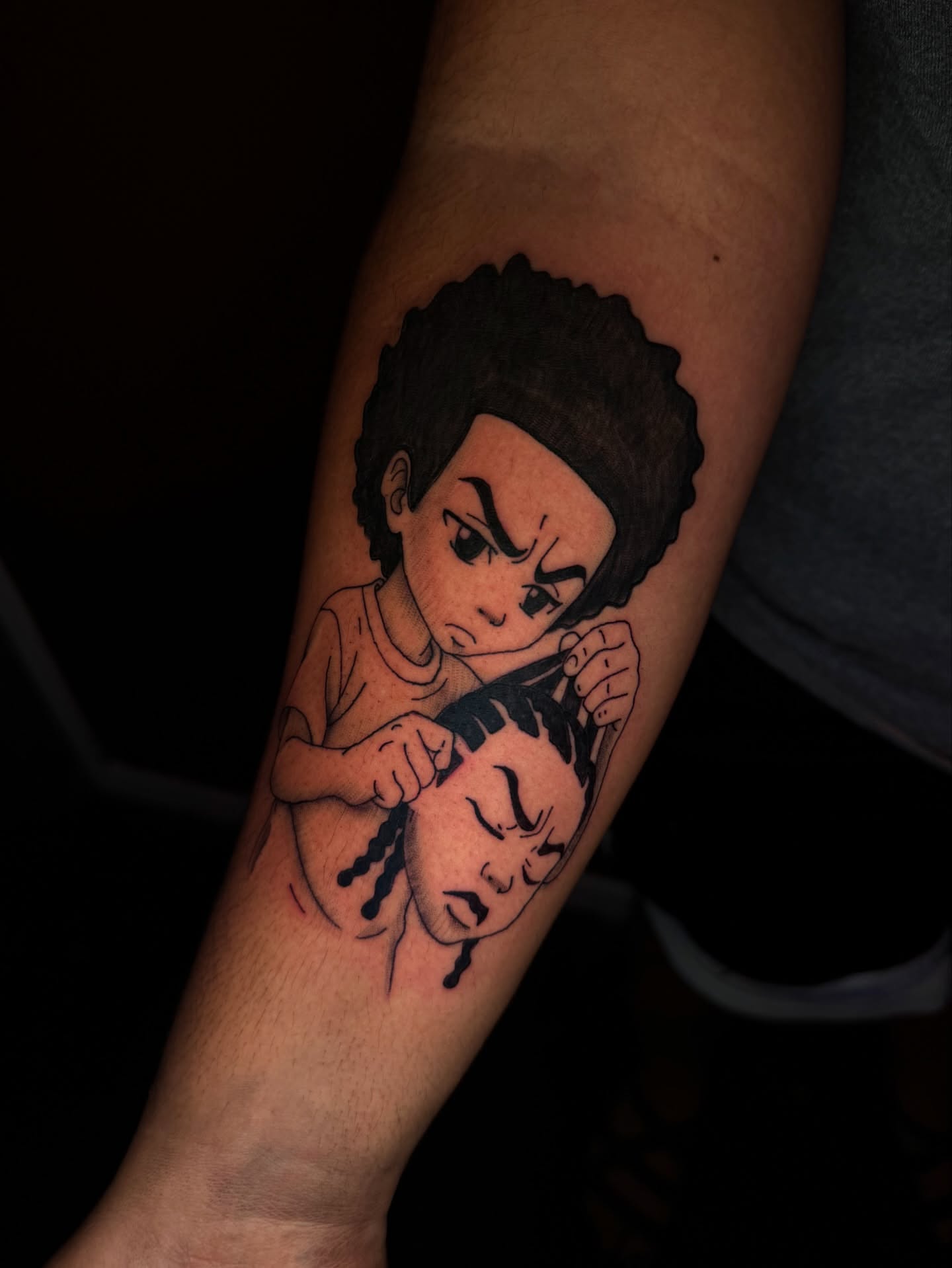 Child combing hair black and grey tattoo on the forearm by Austin Tattoo Artist💉
