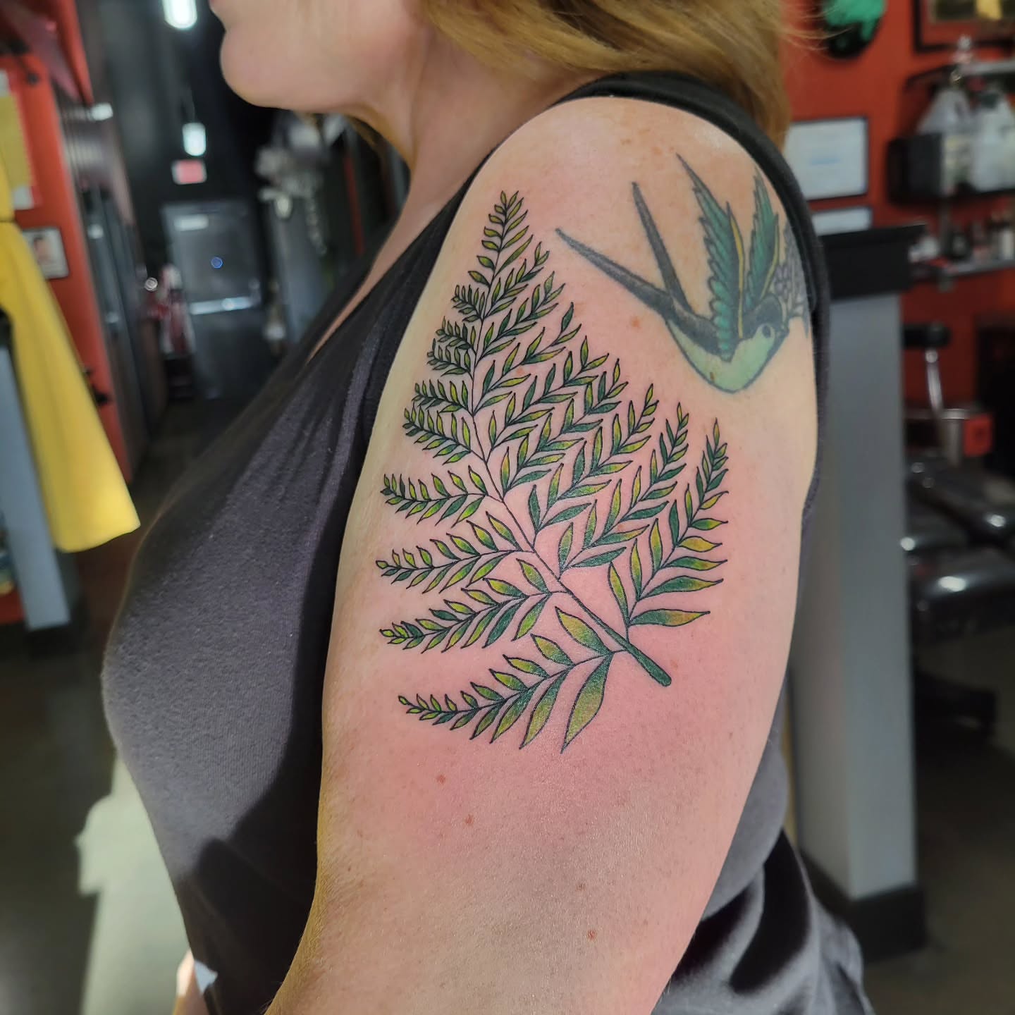 Fern and bird realism tattoo on the shoulder by Aspen C