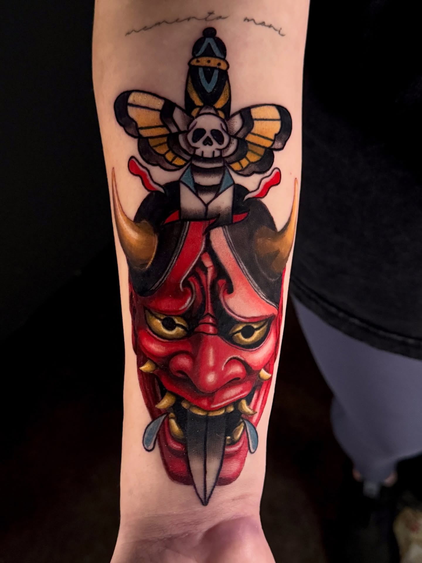Demon mask American traditional tattoo on the forearm by Dallas Tattoo Artist