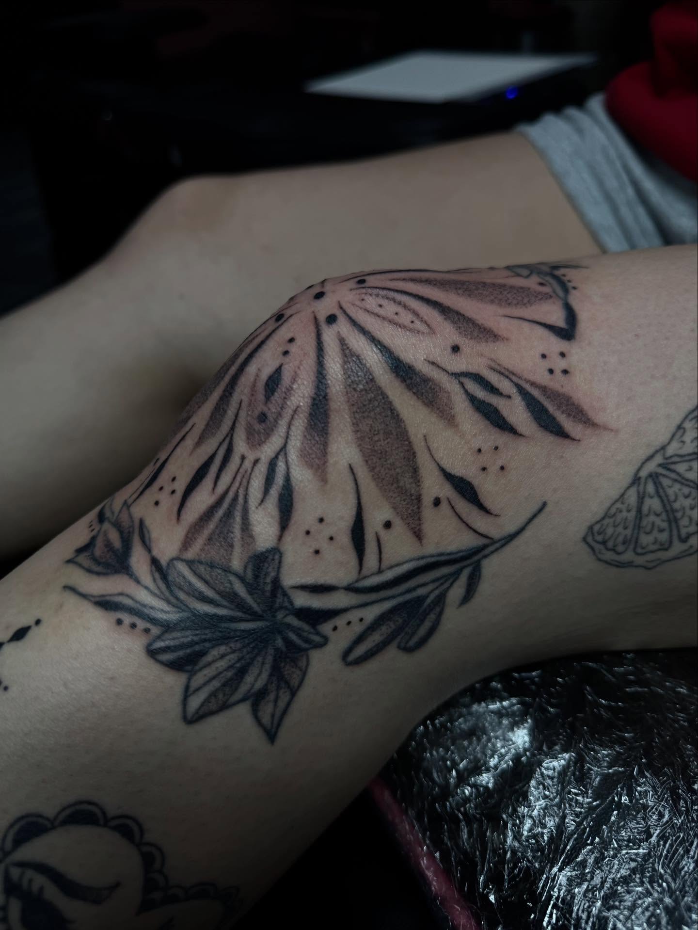 Floral design dotwork tattoo on the forearm by olivia reed