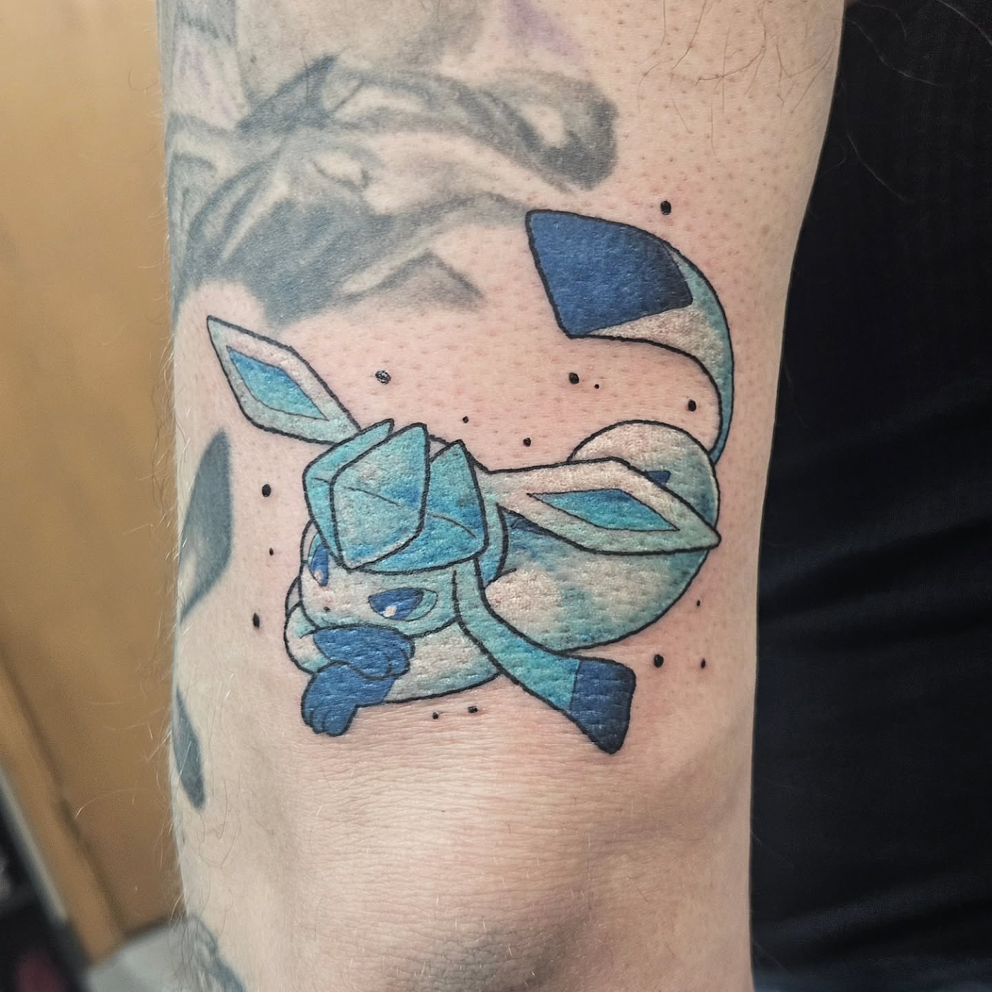 Glaceon dotwork tattoo on the forearm by Damian Eames