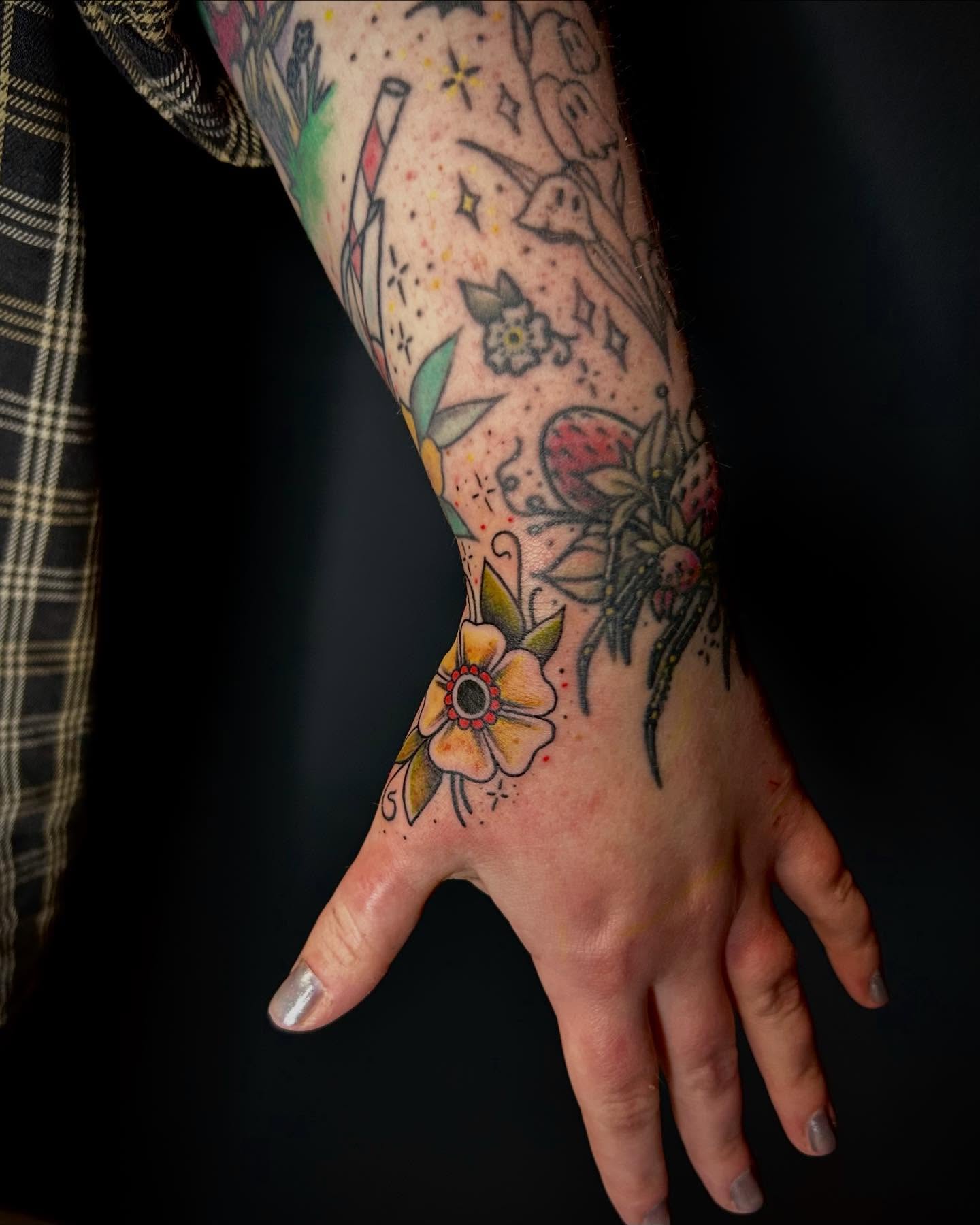 Floral arrangement dotwork tattoo on the hand by Jon Byrd