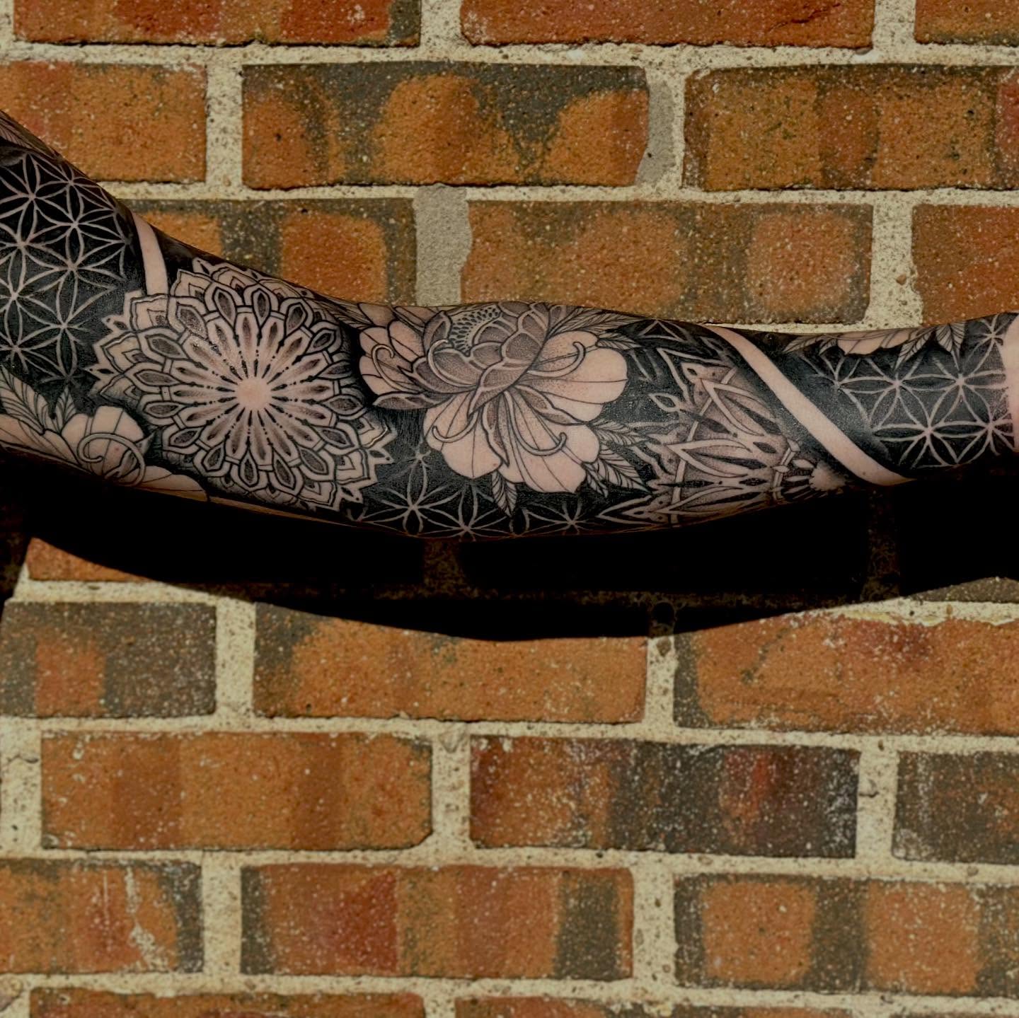Floral mandala dotwork tattoo on the forearm by Leeuh Vandever