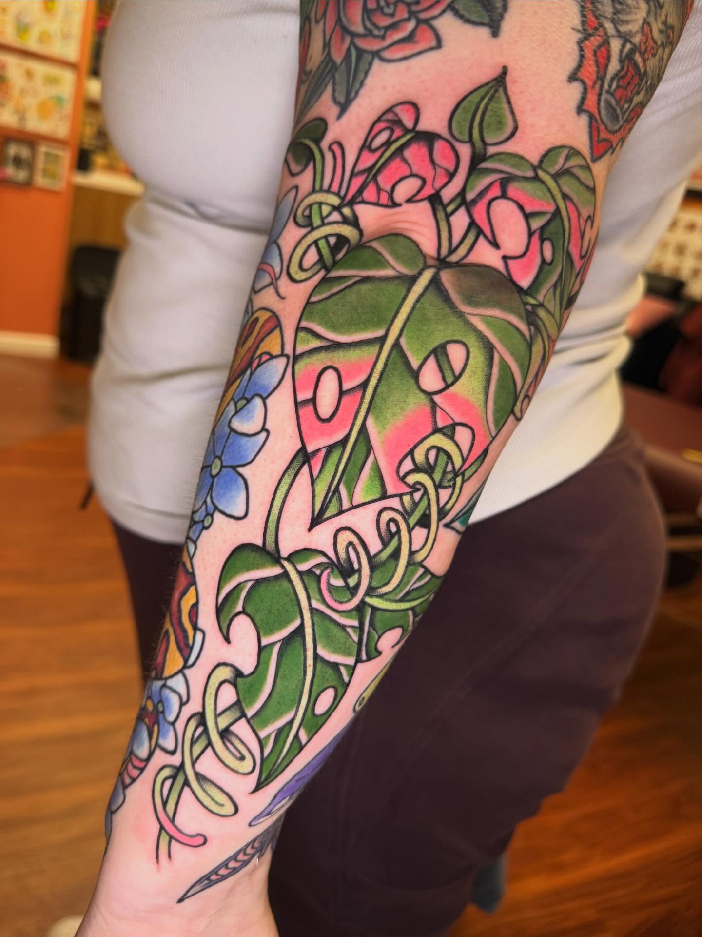 Floral vine American traditional tattoo on the forearm by Cassie O'Neal DeBord