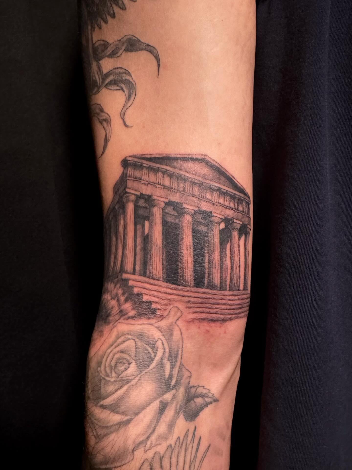 Temple and rose realism tattoo on the forearm by Paris Romano