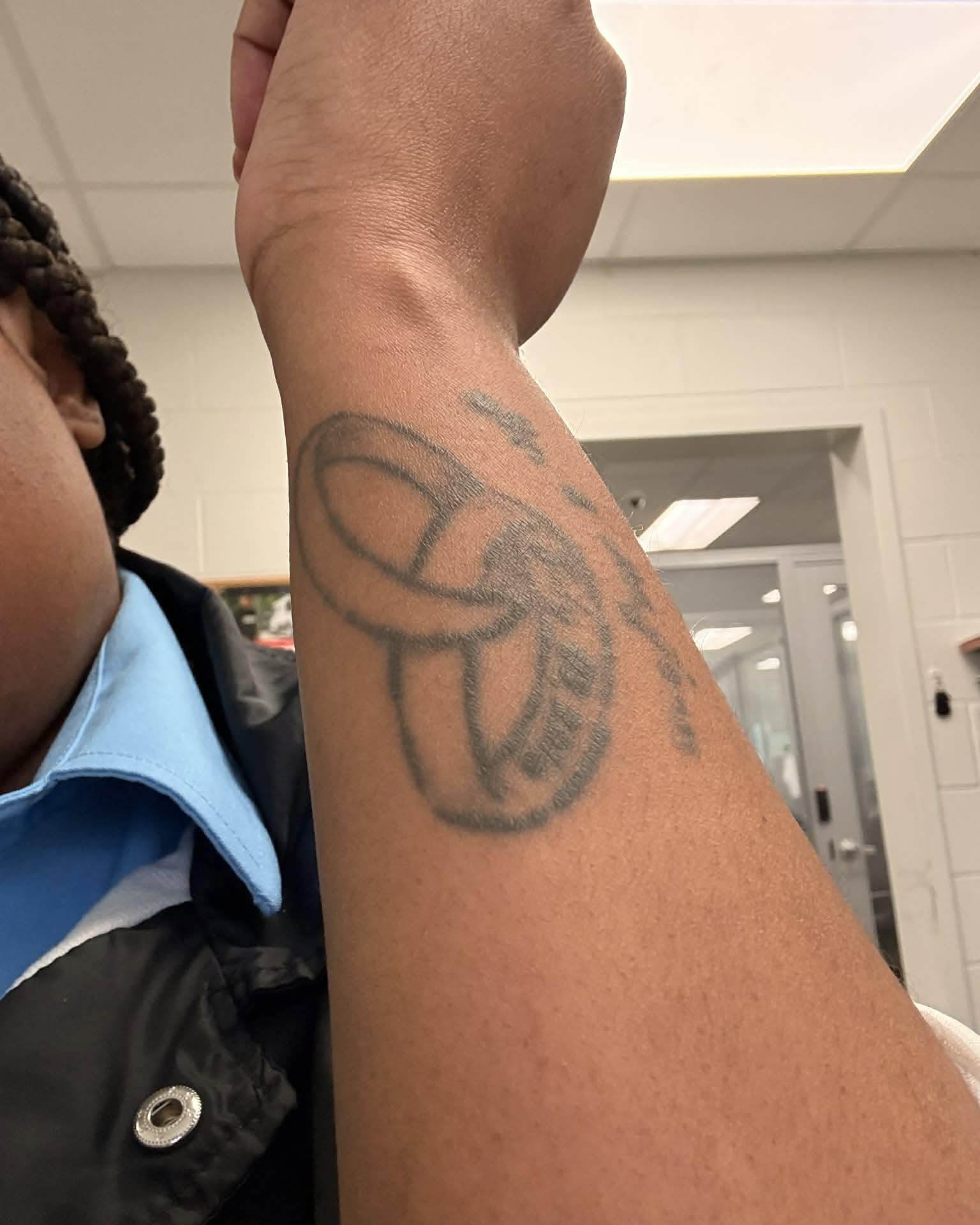Basketball black and grey tattoo on the forearm by Ferlandis Fitch, Long Beach, California