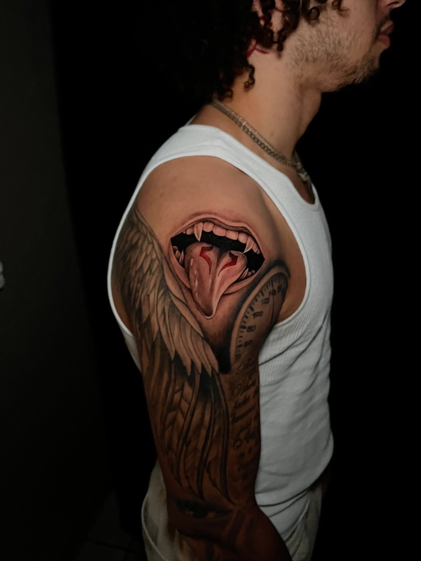 Wolf realism tattoo on the upper arm by Jake, Salt Lake City, Utah