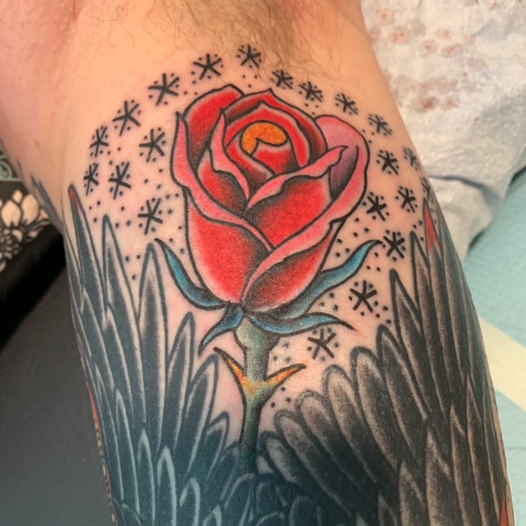 Red rose American traditional tattoo on the forearm by Mike Kepper