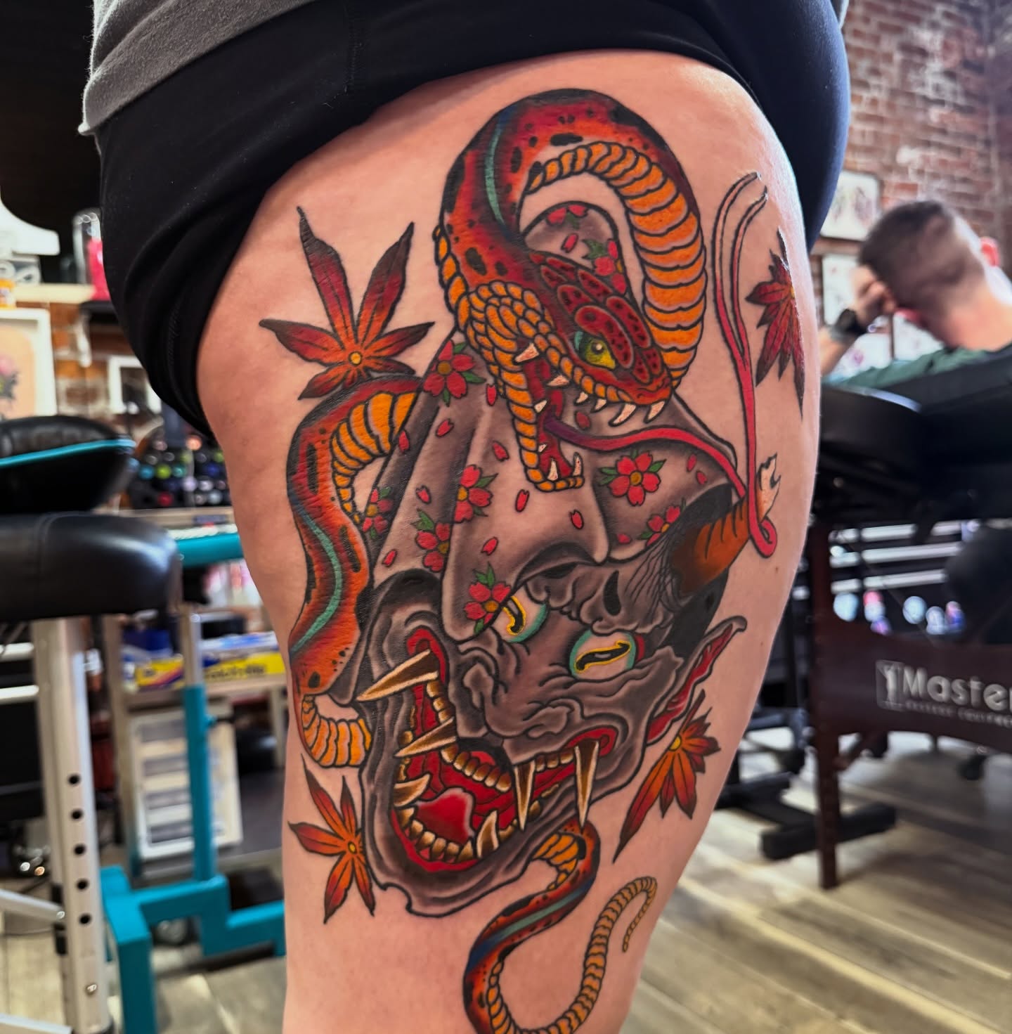 Skull with snakes japanese irezumi tattoo on the thigh by Trevor Berry