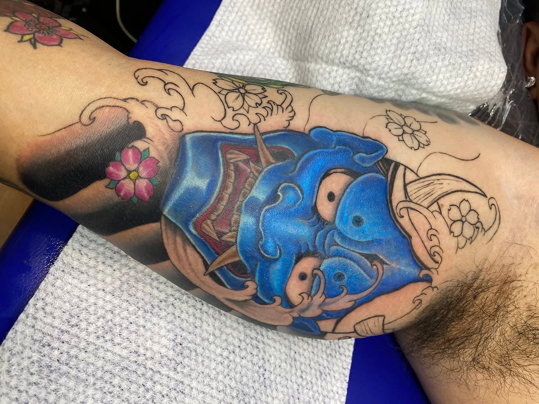 Oni mask and waves Japanese tattoo on the forearm by Ferds Villanueva